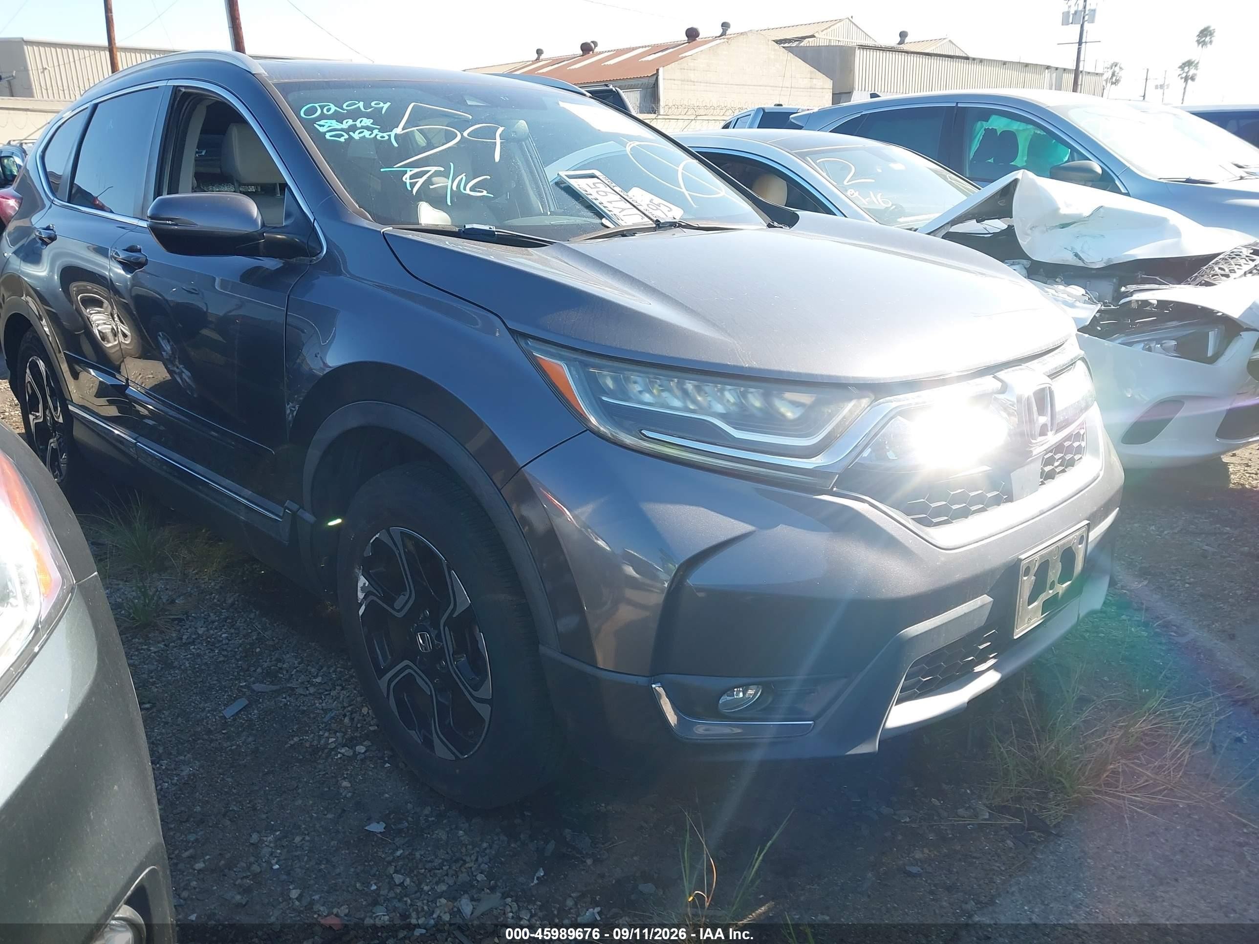 2017 Honda CR-V VIN 2HKRW1H94HH517587 — IAAI salvage auction photo