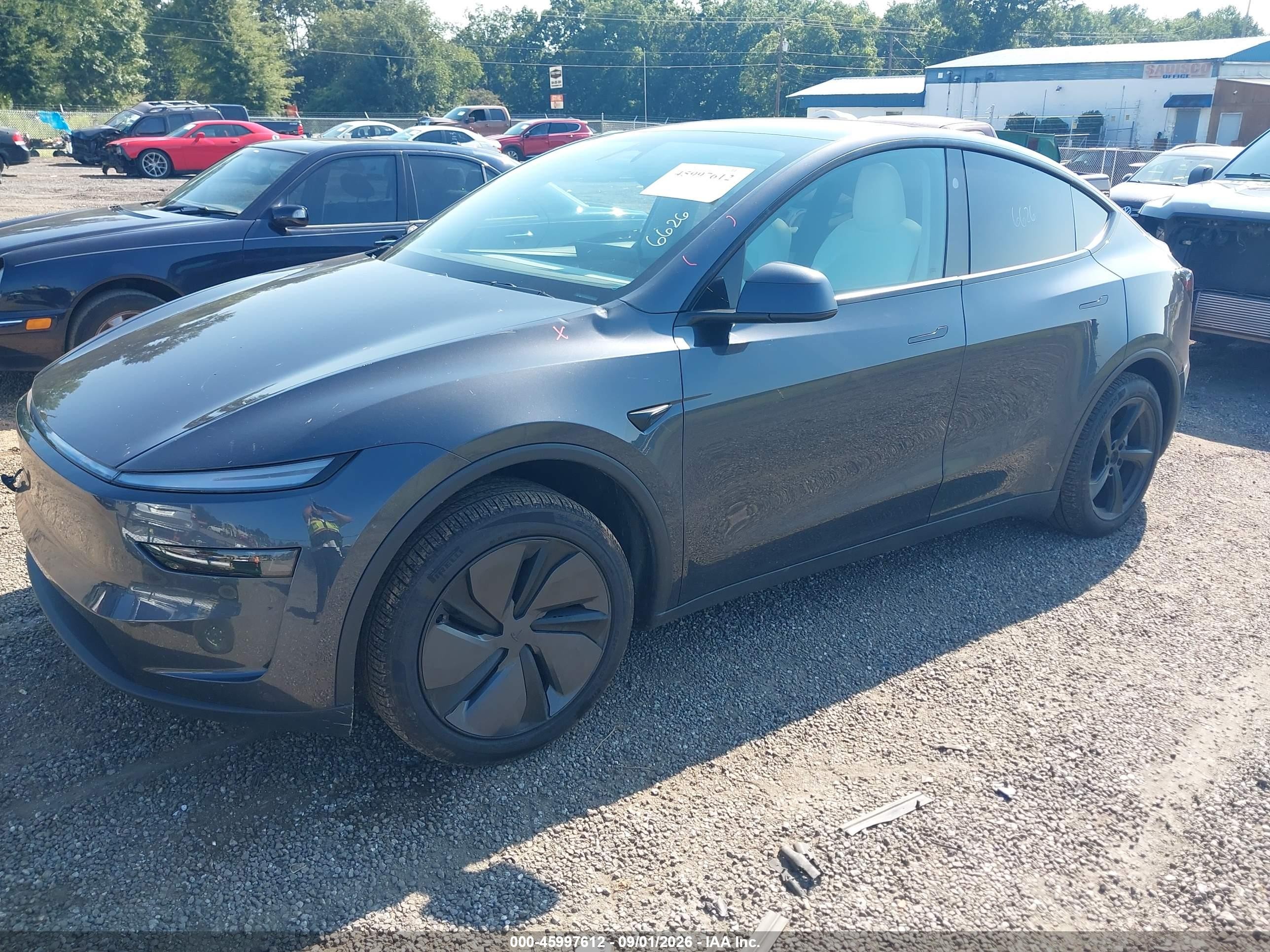 2026 Tesla Model Y VIN 7SAYGDEE4TA443185 IAAI salvage auction — Side, Salvage (South Carolina), sold $22,800 on 2026-09-23 (photo 2)