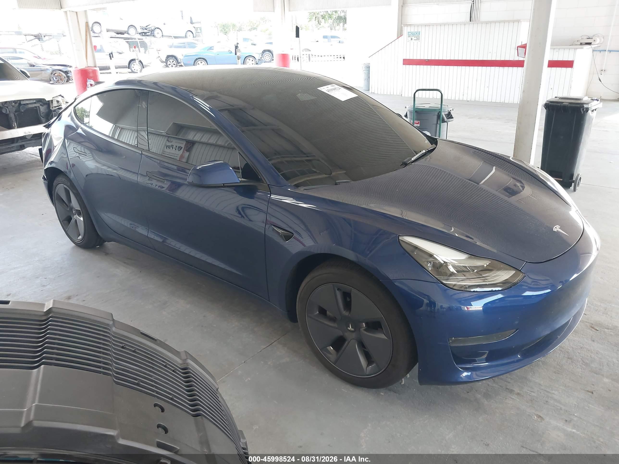 2023 Tesla Model 3 VIN 5YJ3E1EA2PF573516 — IAAI salvage auction photo