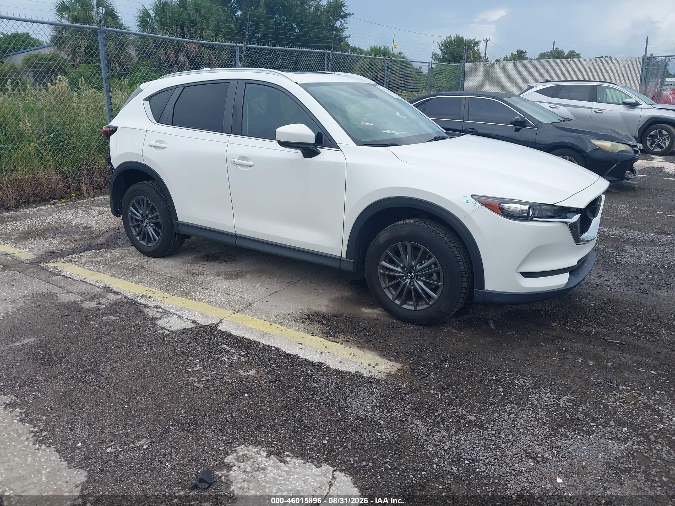 2021 Mazda CX-5 VIN JM3KFACM2M0416348 — IAAI salvage auction photo
