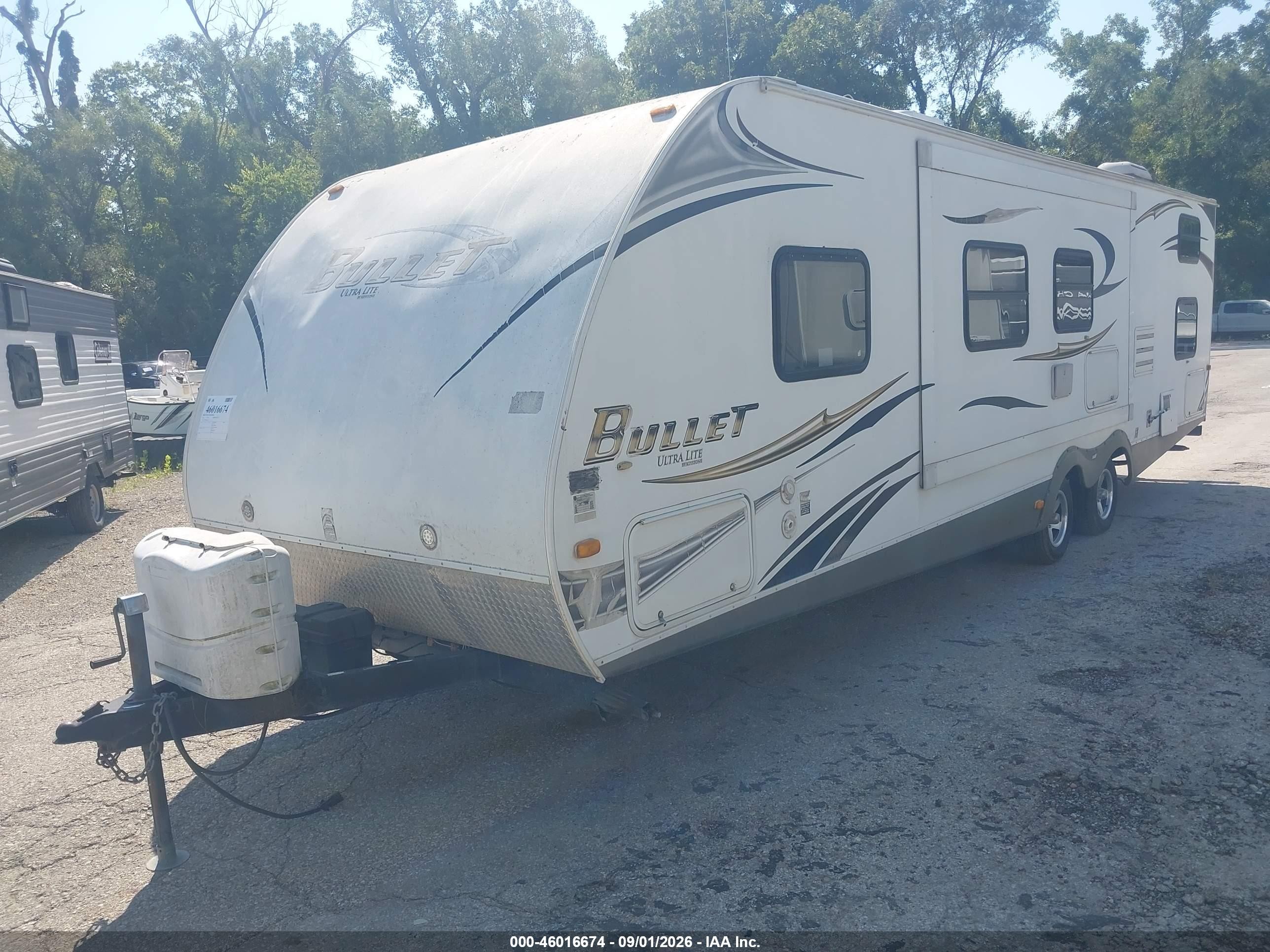 2011 Keys 286qbs-bullet Ults L VIN 4YDT28622BD422374 IAAI salvage auction — Side, Certificate Of Title (Nebraska), sold $1,875 on 2026-09-30 (photo 2)