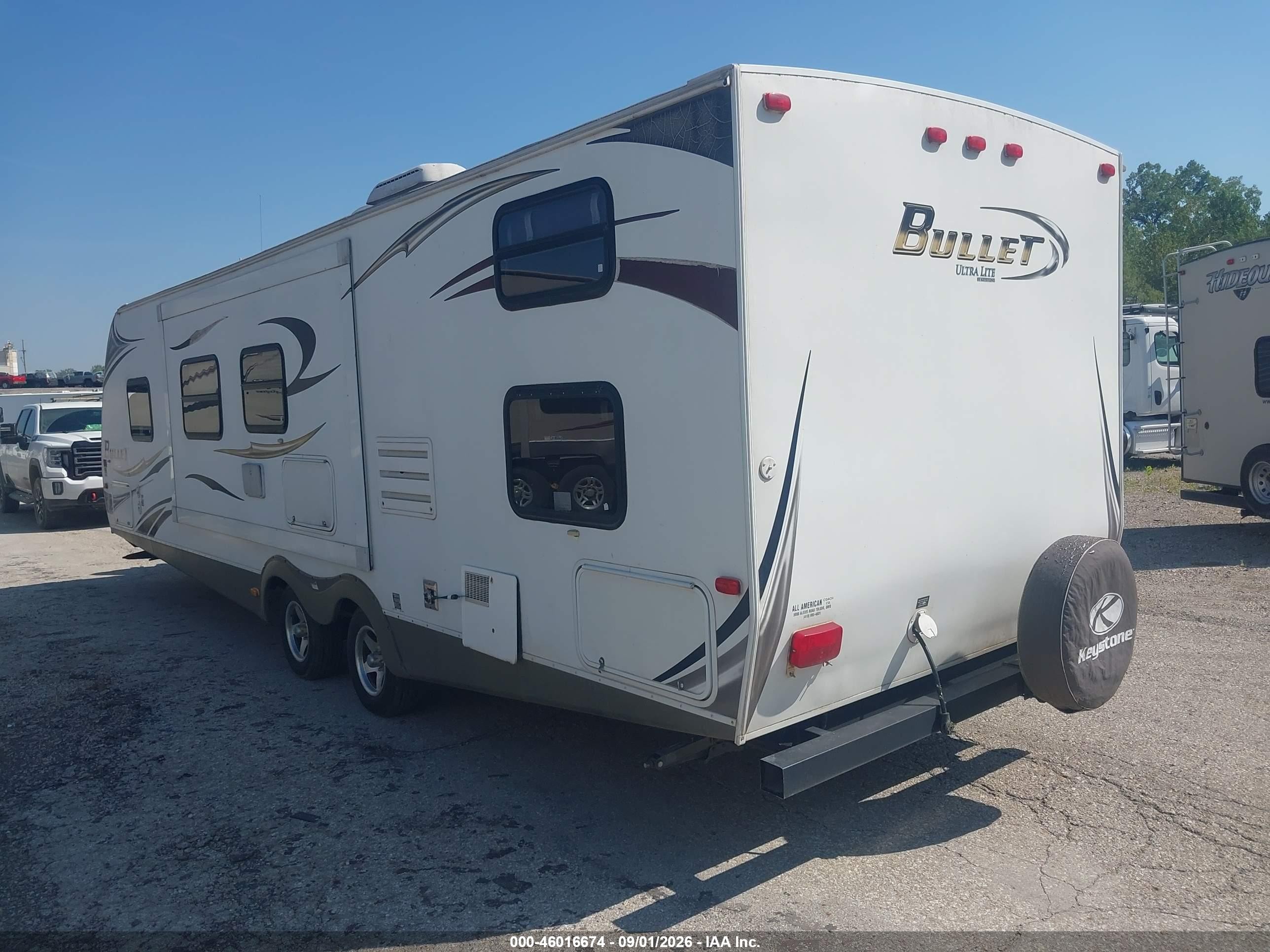 2011 Keys 286qbs-bullet Ults L VIN 4YDT28622BD422374 IAAI salvage auction — Side, Certificate Of Title (Nebraska), sold $1,875 on 2026-09-30 (photo 3)