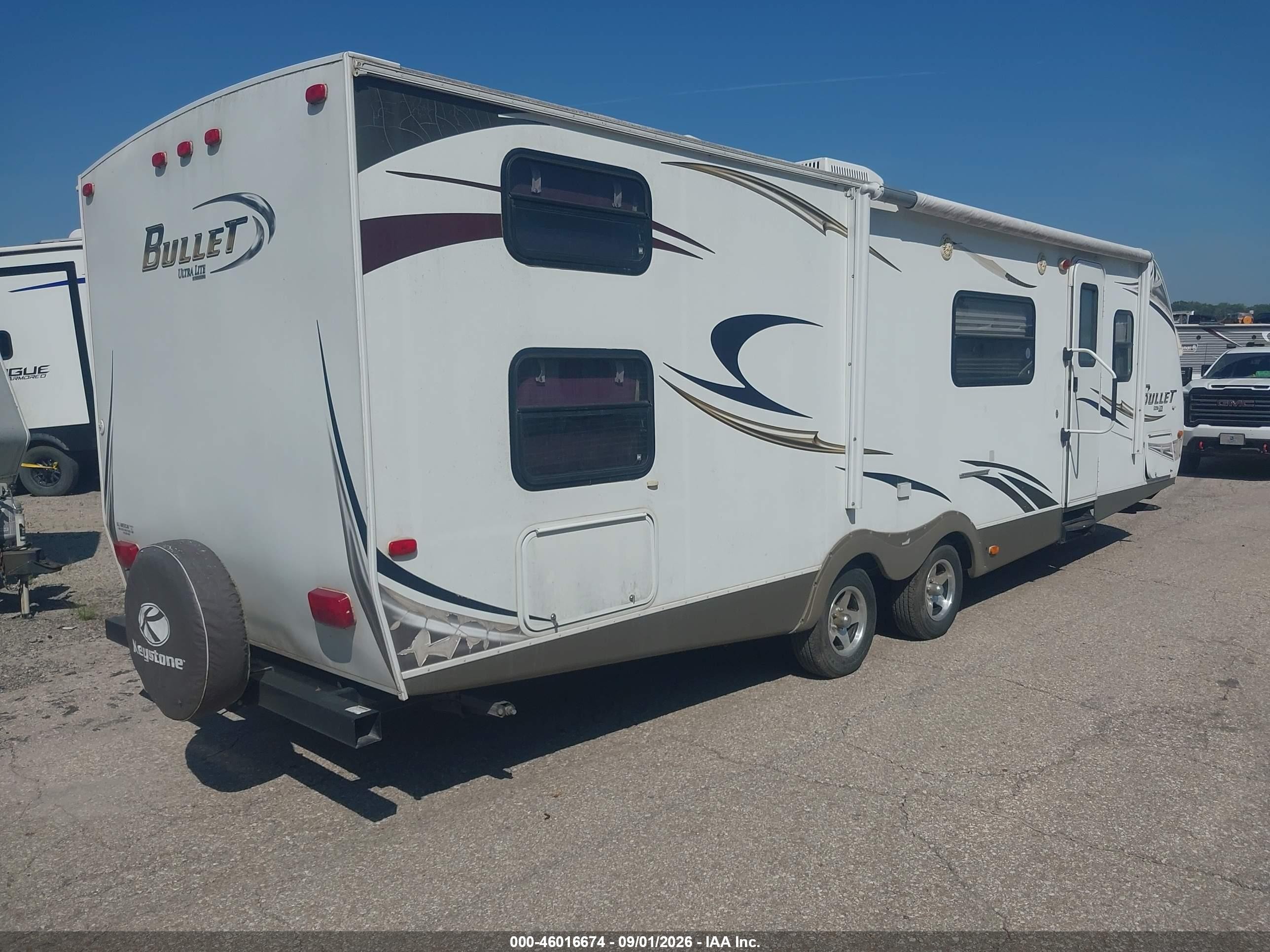 2011 Keys 286qbs-bullet Ults L VIN 4YDT28622BD422374 IAAI salvage auction — Side, Certificate Of Title (Nebraska), sold $1,875 on 2026-09-30 (photo 4)