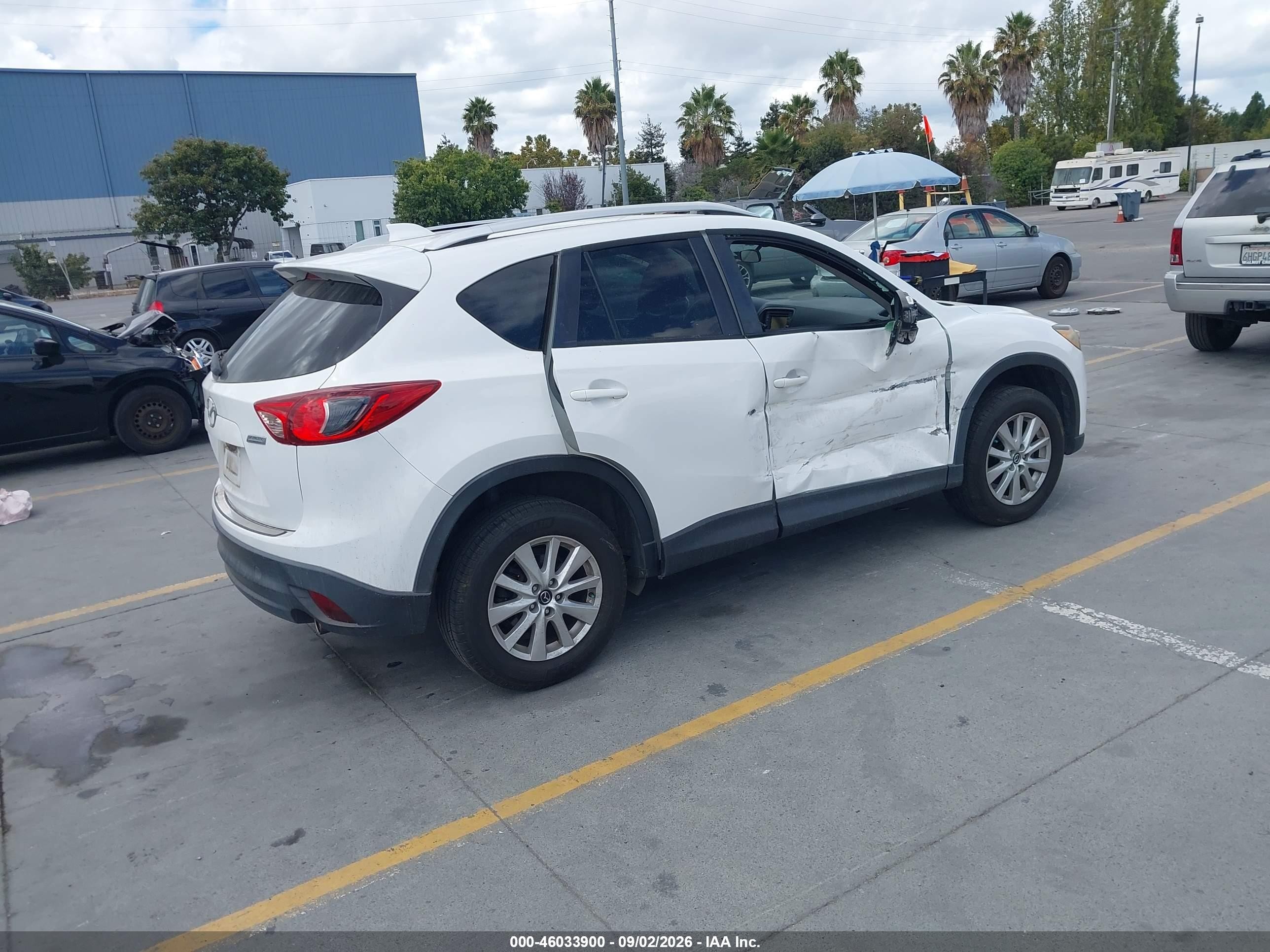 2014 Mazda Cx-5 VIN JM3KE4CY7E0375210 IAAI salvage auction — Side, Salvage (California), sold $2,900 on 2026-09-14 (photo 4)
