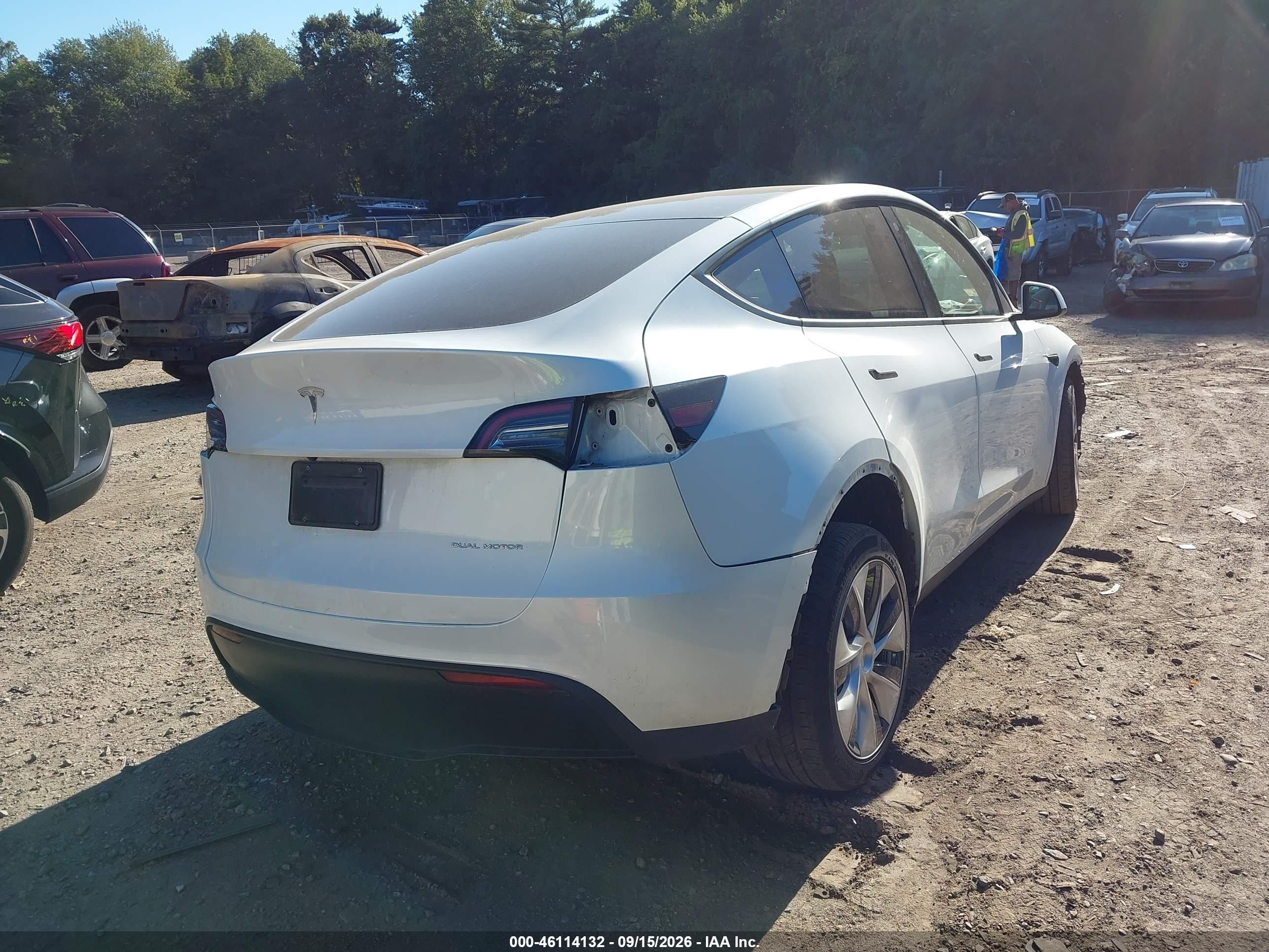 2023 Tesla Model y VIN 7SAYGDEE4PF706185 IAAI salvage auction — Unknown, Salvage (Massachusetts), sold $11,300 on 2026-09-29 (photo 4)