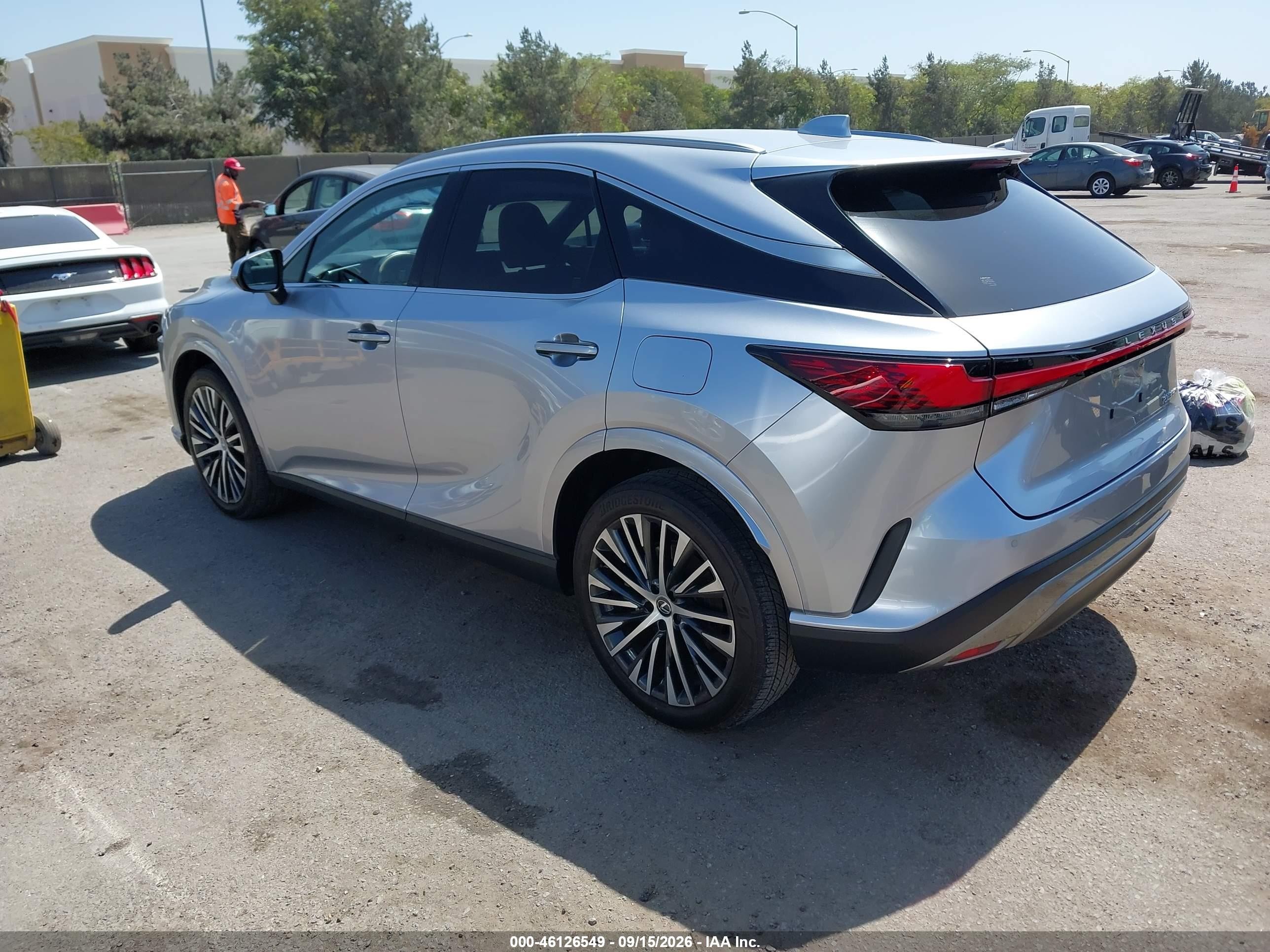 2025 Lexus Rx VIN JTJCHMAA3S2021157 IAAI salvage auction — Side, Salvage (California), sold $29,900 on 2026-10-01 (photo 3)