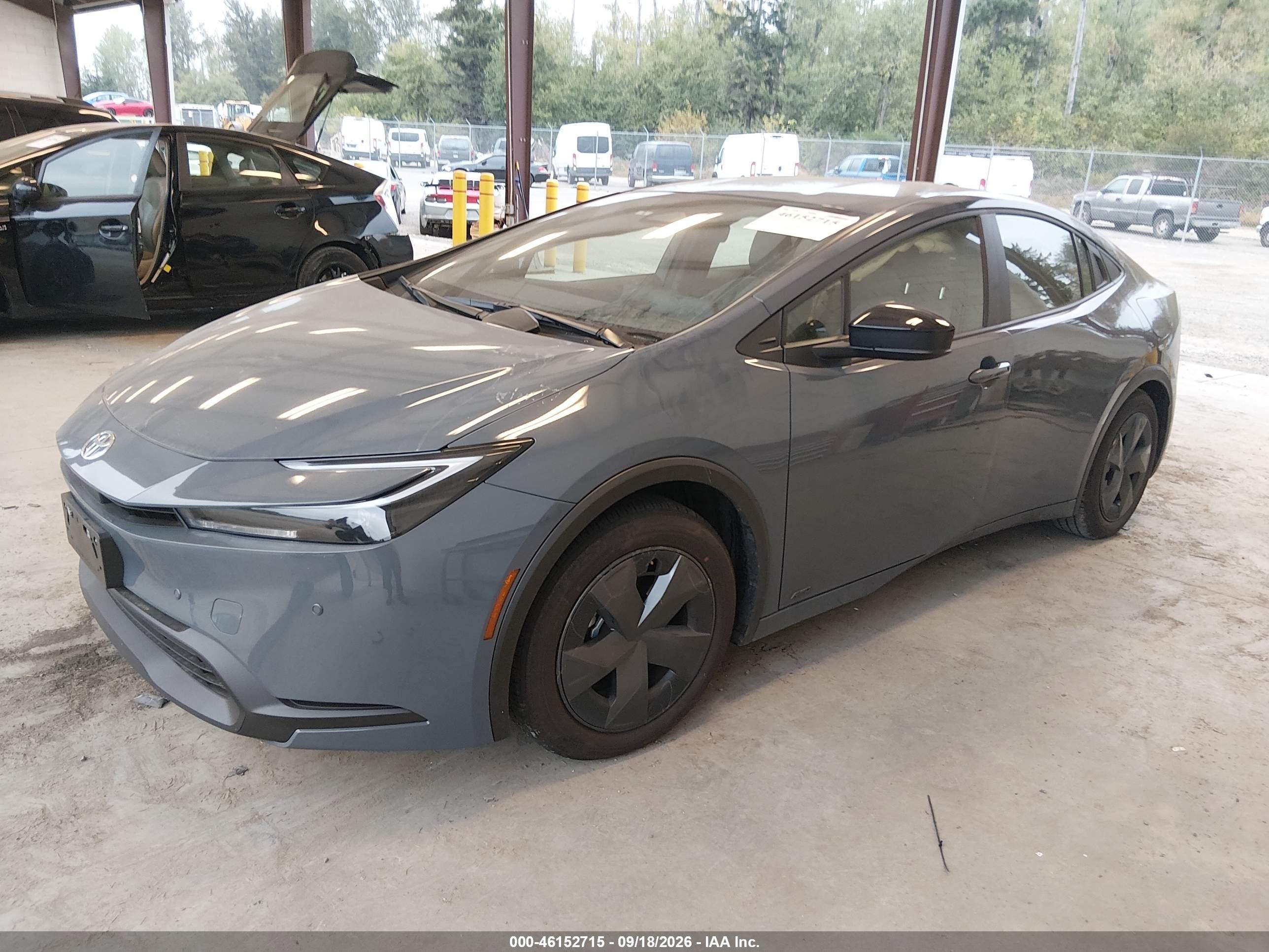 2026 Toyota Prius VIN JTDADABU8T3032728 IAAI salvage auction — Side, Bill Of Sale (Washington), sold $11,900 on 2026-10-15 (photo 2)