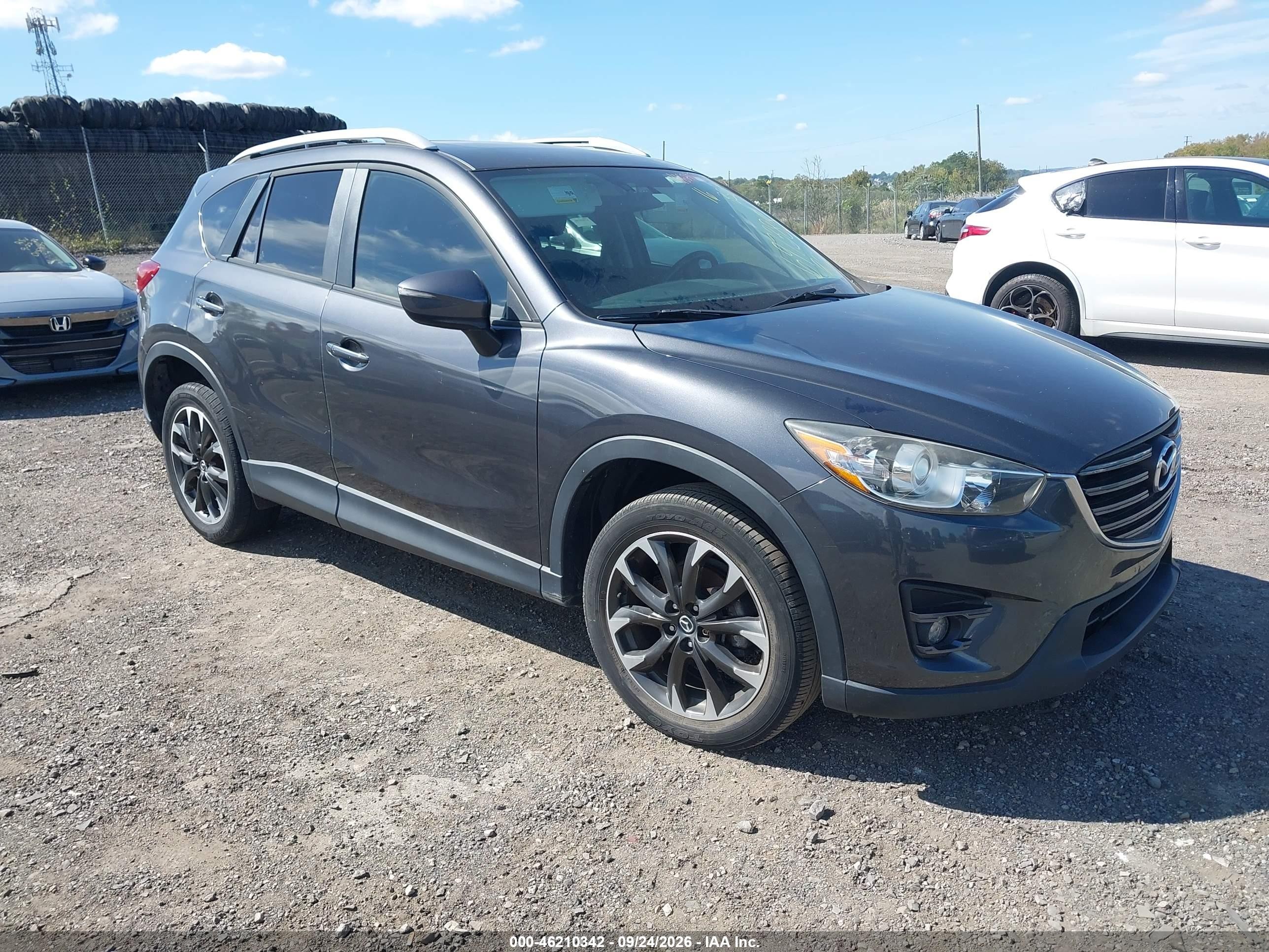 2016 Mazda Cx-5 VIN JM3KE2DY6G0697388 IAAI salvage auction — Theft, Rebuildable (Florida), sold $5,300 on 2026-10-07 (photo 1)