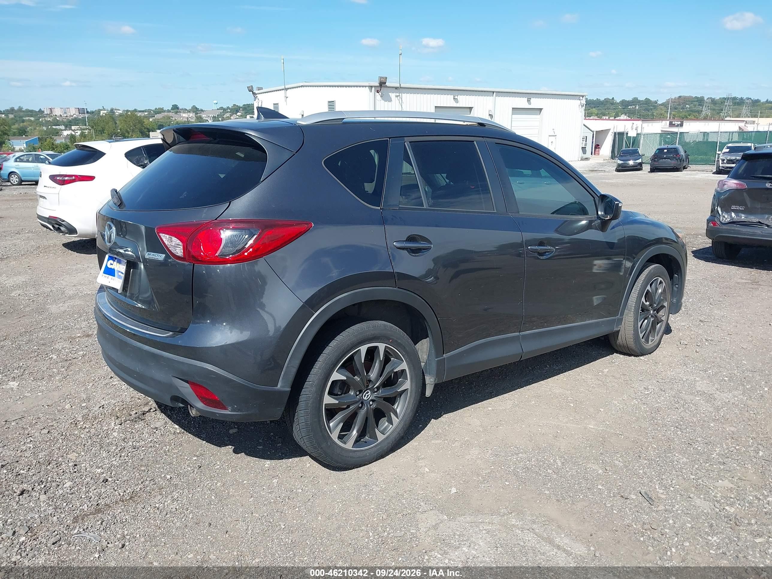 2016 Mazda Cx-5 VIN JM3KE2DY6G0697388 IAAI salvage auction — Theft, Rebuildable (Florida), sold $5,300 on 2026-10-07 (photo 4)