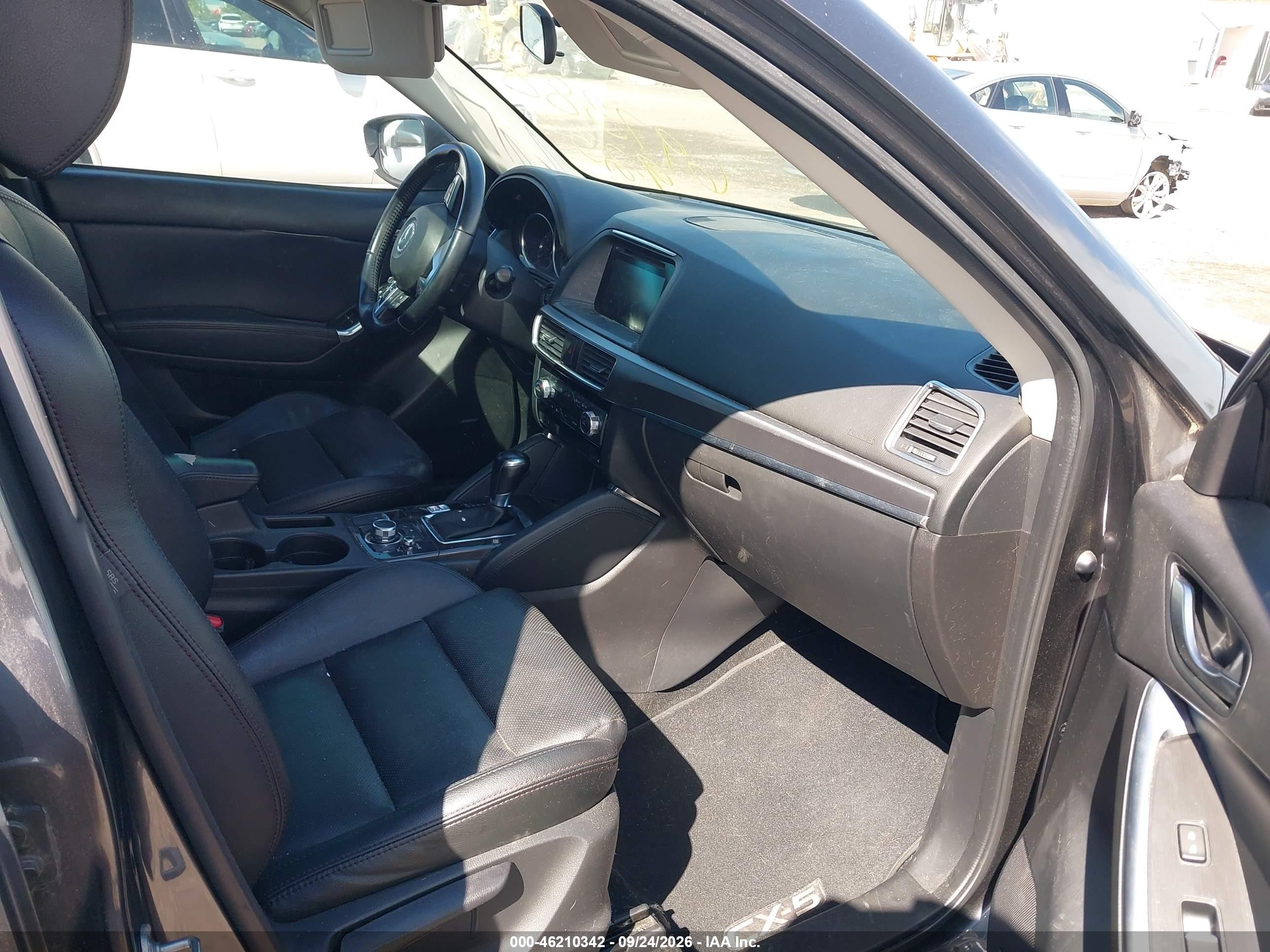 2016 Mazda Cx-5 VIN JM3KE2DY6G0697388 IAAI salvage auction — Theft, Rebuildable (Florida), sold $5,300 on 2026-10-07 (photo 5)