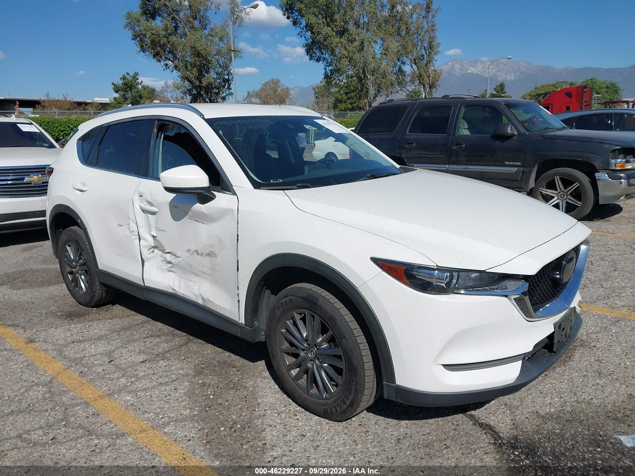 2020 Mazda CX-5 VIN JM3KFACM5L0853985 — IAAI salvage auction photo
