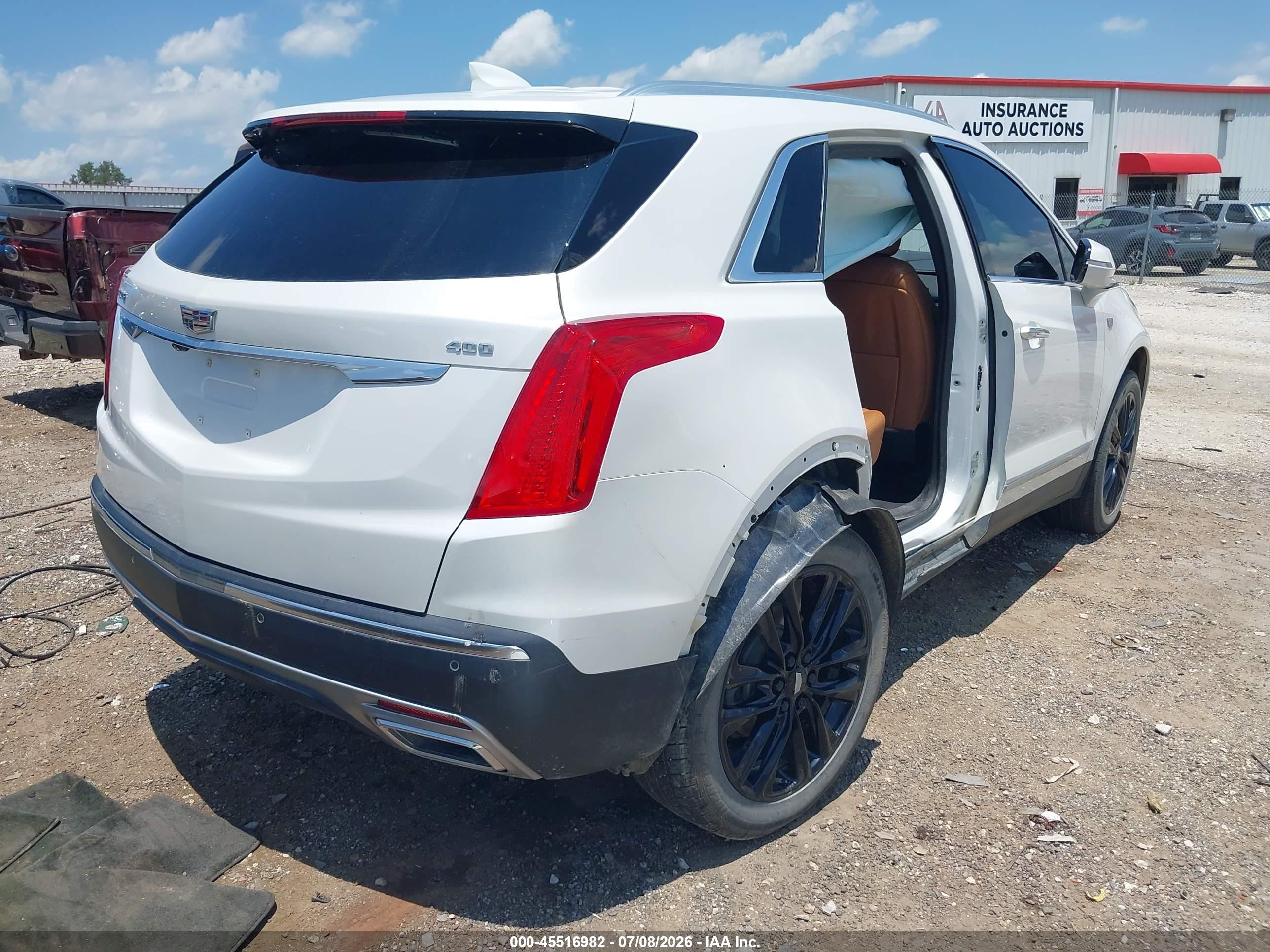 2021 Cadillac Xt5 VIN 1GYKNCRS5MZ236025 IAAI salvage auction — Side, Clear (Arkansas), sold $9,000 on 2026-09-05 (photo 4)