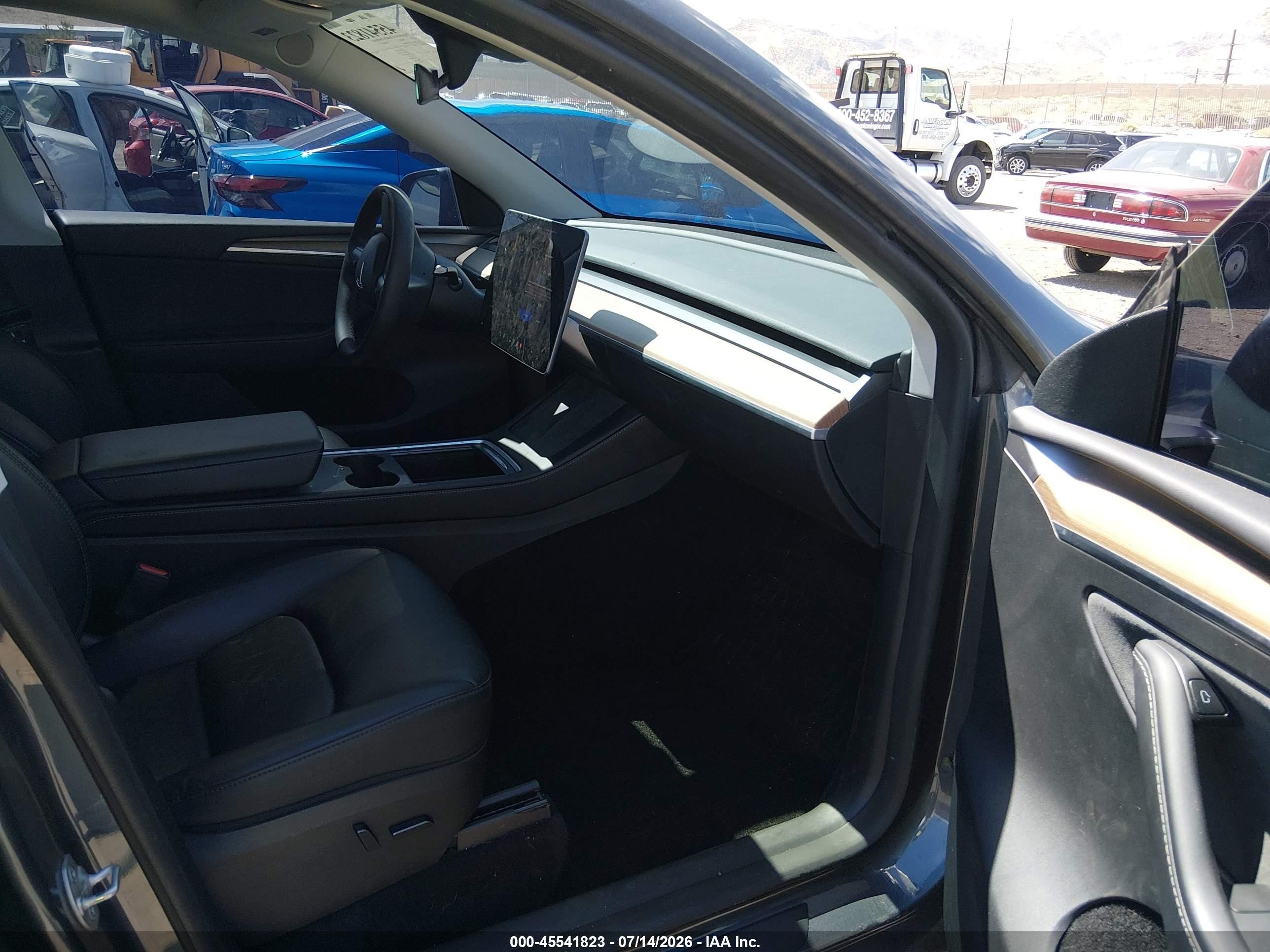 2023 Tesla Model Y VIN 7SAYGAEE3PF902486 IAAI salvage auction — Unknown, Salvage (Nevada), sold $12,200 on 2026-09-19 (photo 5)