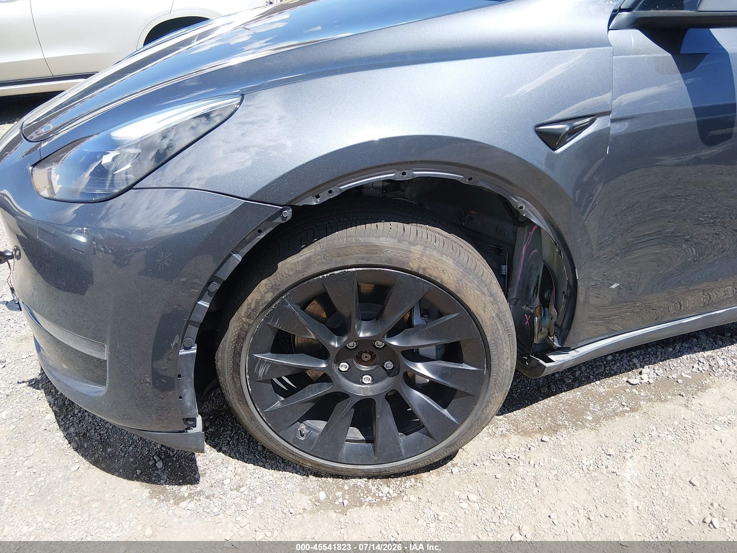 2023 Tesla Model Y VIN 7SAYGAEE3PF902486 IAAI salvage auction — Unknown, Salvage (Nevada), sold $12,200 on 2026-09-19 (photo 6)
