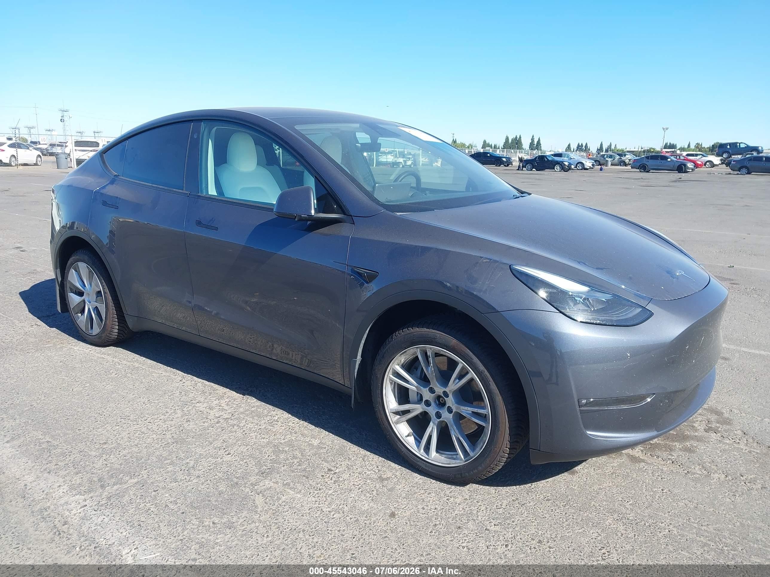 2023 Tesla Model Y VIN 7SAYGAEE5PF640163 — IAAI salvage auction photo