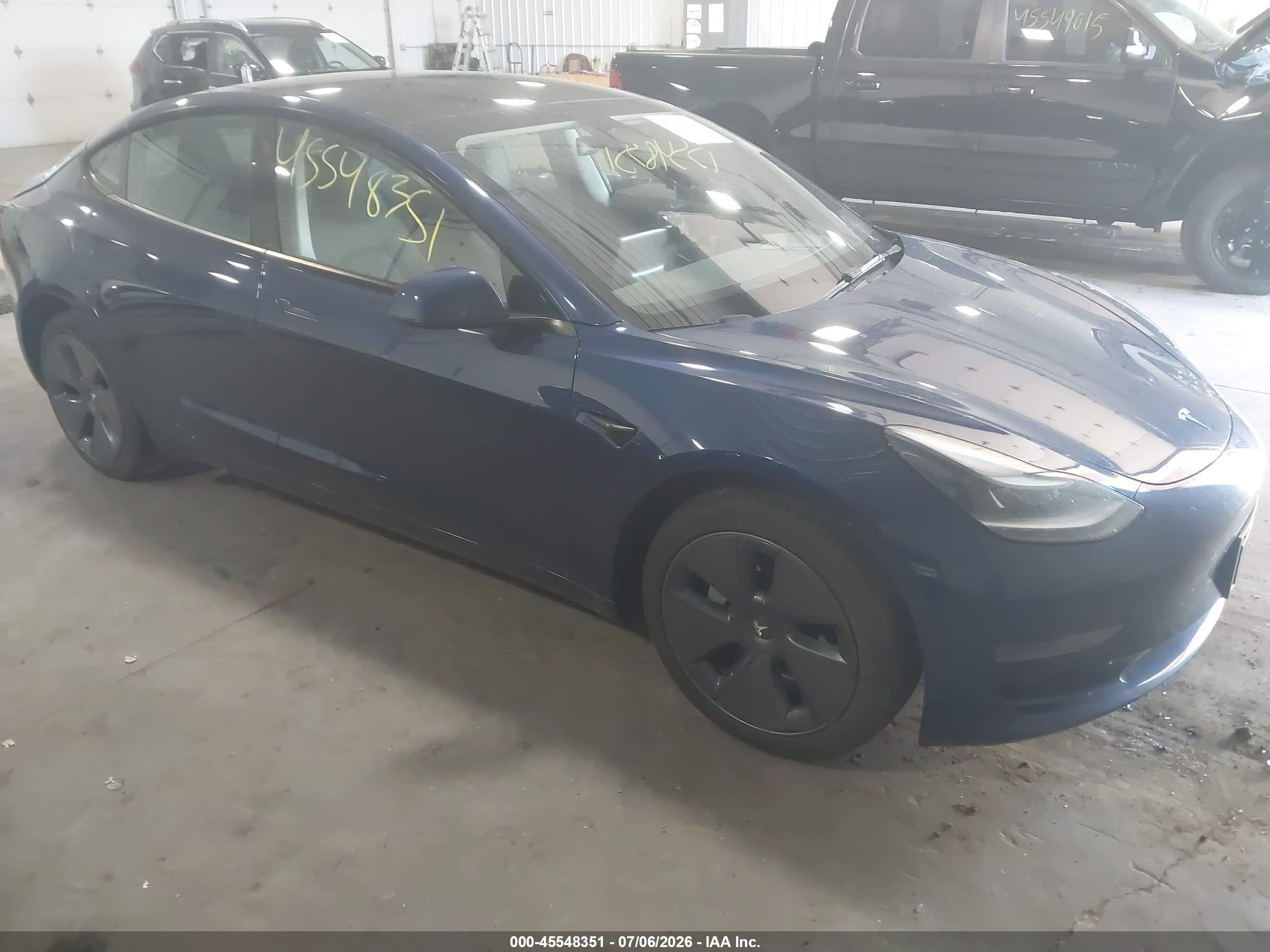 2023 Tesla Model 3 VIN 5YJ3E1EA1PF652708 — IAAI salvage auction photo