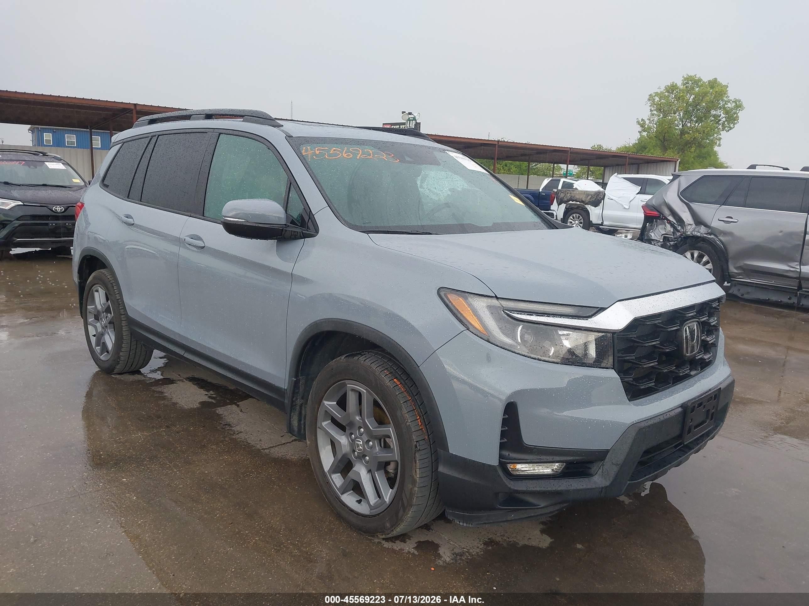 2023 Honda Passport VIN 5FNYF8H58PB011310 — IAAI salvage auction photo