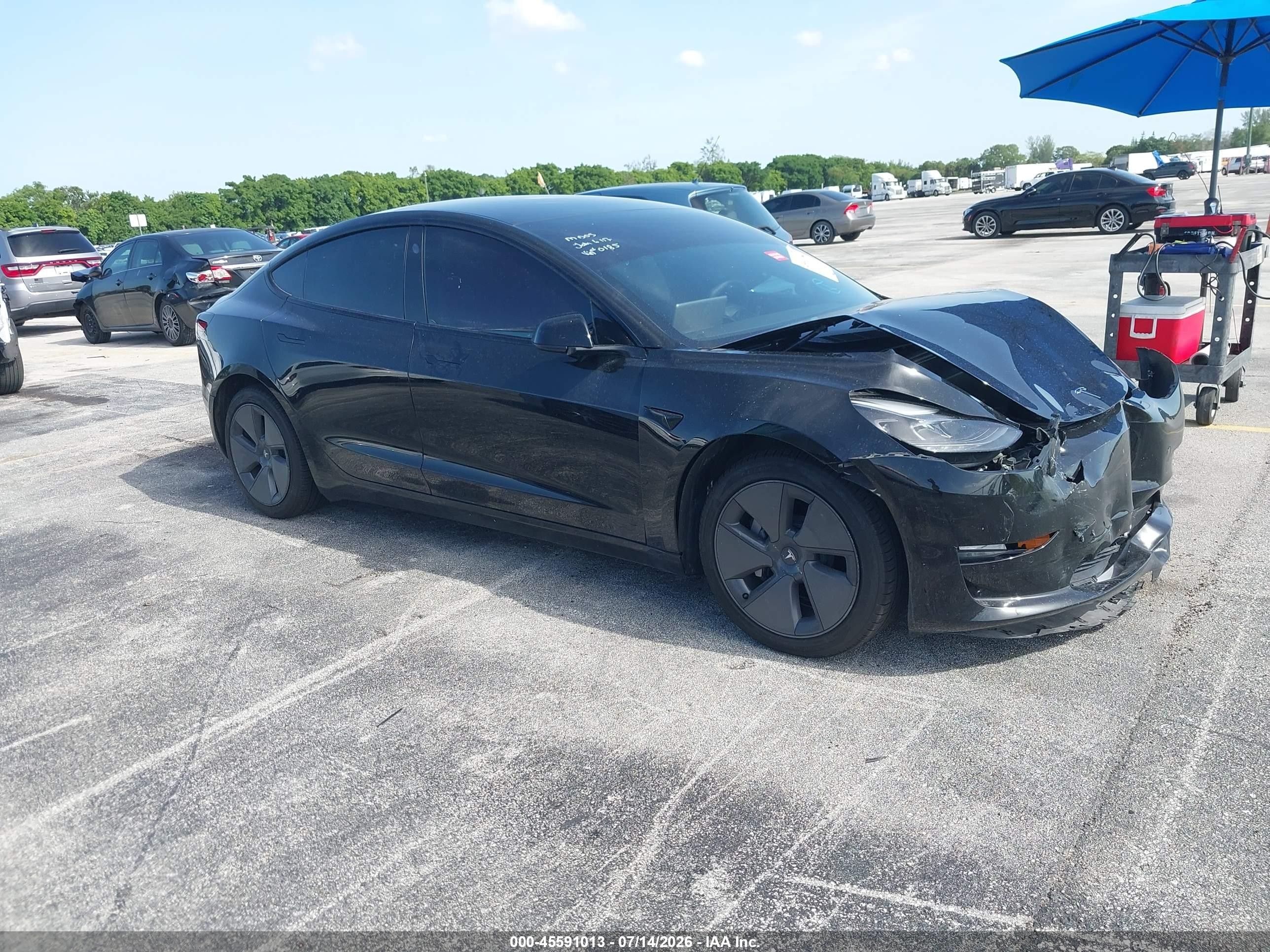 2022 Tesla Model 3 VIN 5YJ3E1EA7NF110185 — IAAI salvage auction photo