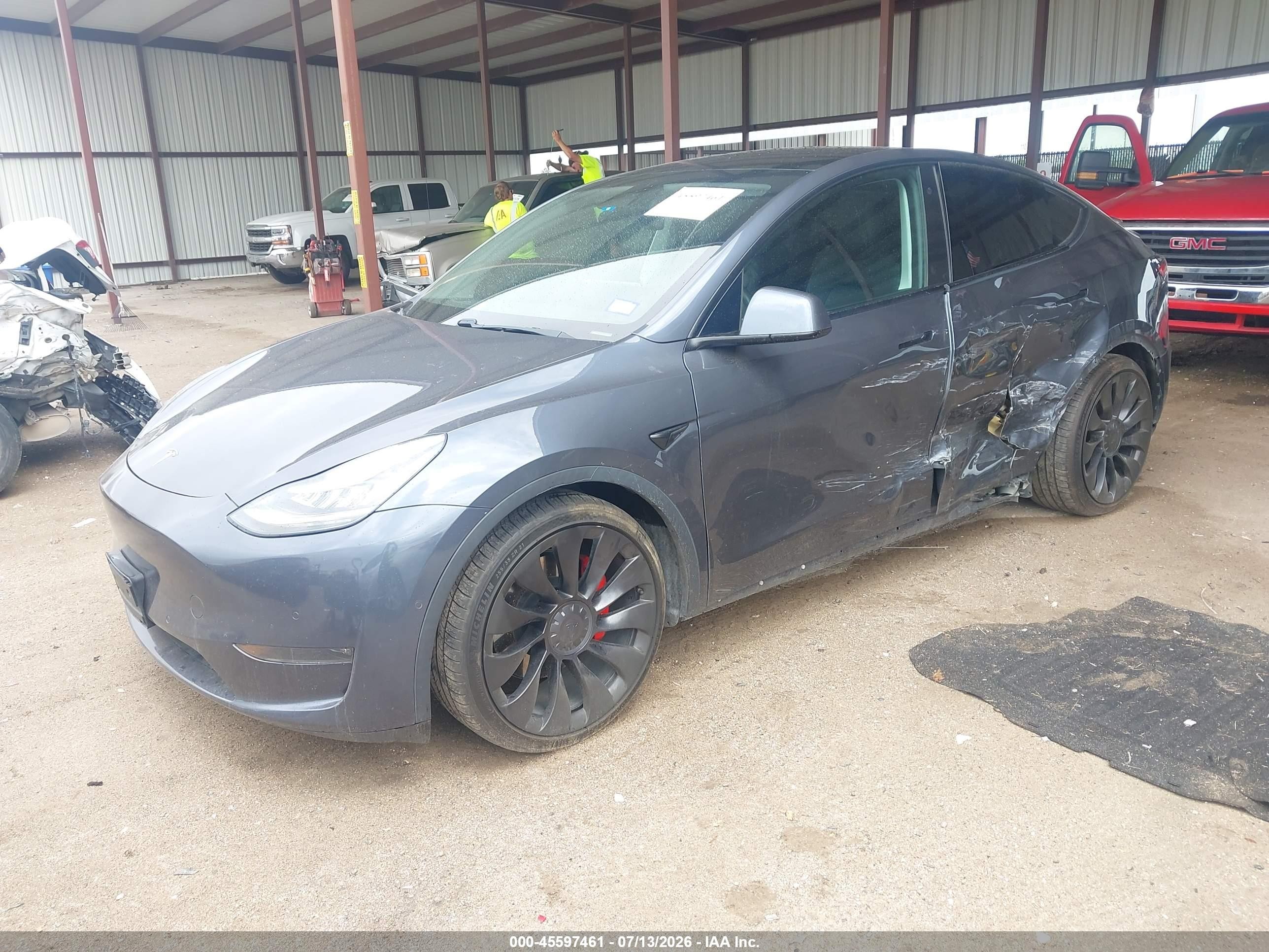 2020 Tesla Model y VIN 5YJYGDEF1LF025322 IAAI salvage auction — Side, Original (Texas), sold $9,600 on 2026-10-08 (photo 2)