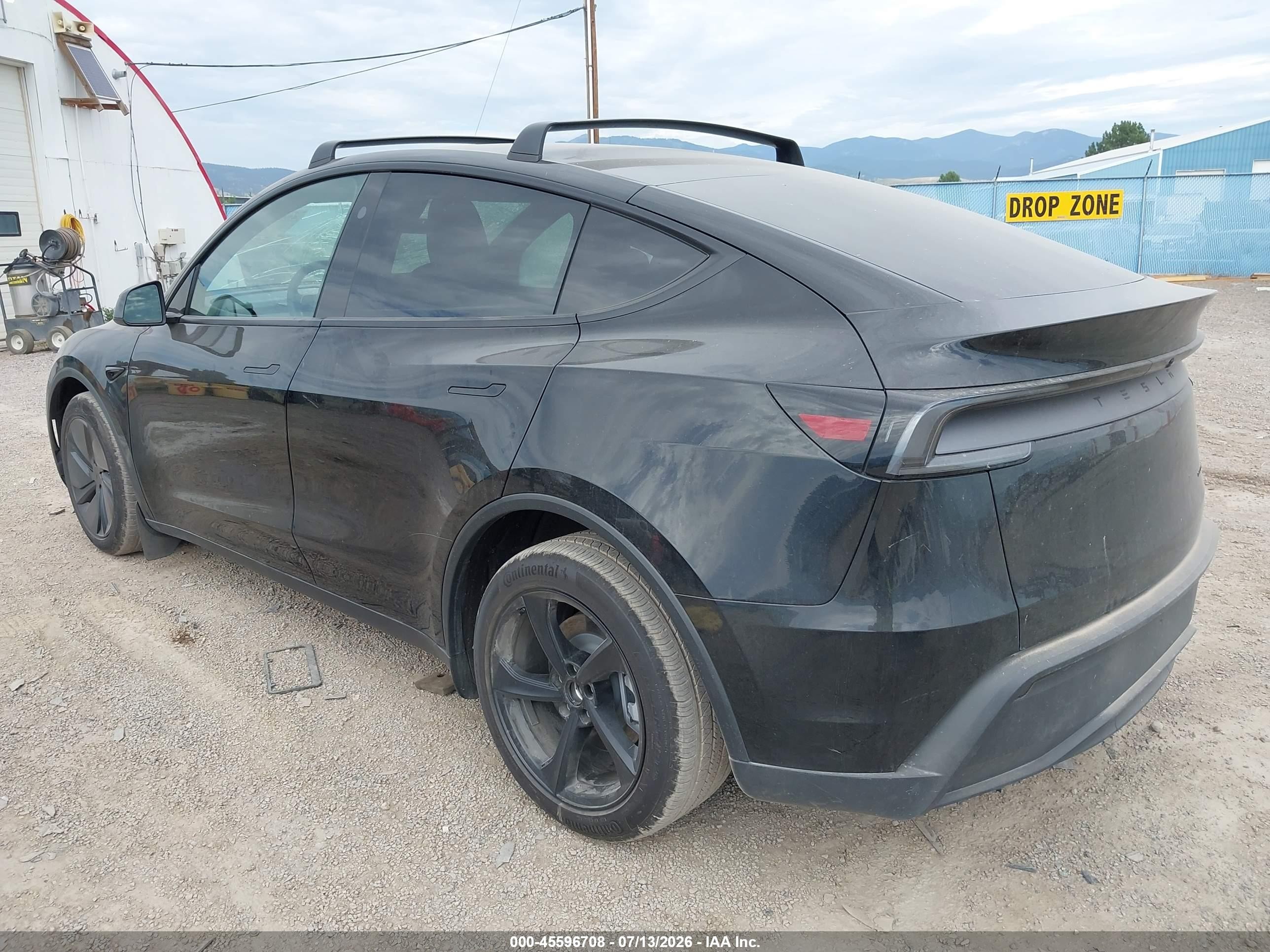 2026 Tesla Model y VIN 7SAYGDEE8TF628908 IAAI salvage auction — Side, Salvage (Montana), sold $29,250 on 2026-10-01 (photo 3)