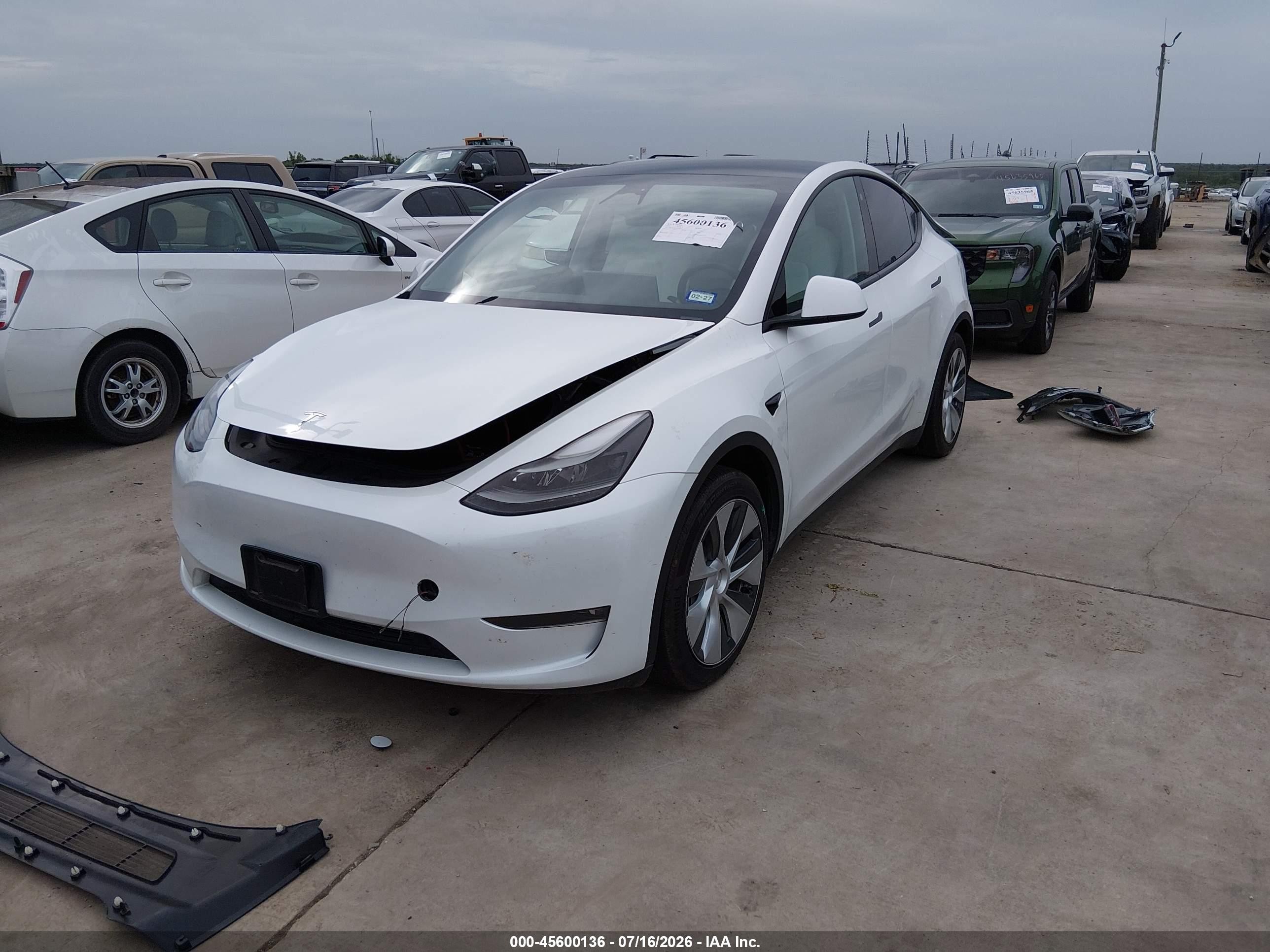 2023 Tesla Model y VIN 7SAYGAEE7PF682561 IAAI salvage auction — Rear End, Salvage (Texas), sold $13,100 on 2026-09-29 (photo 2)