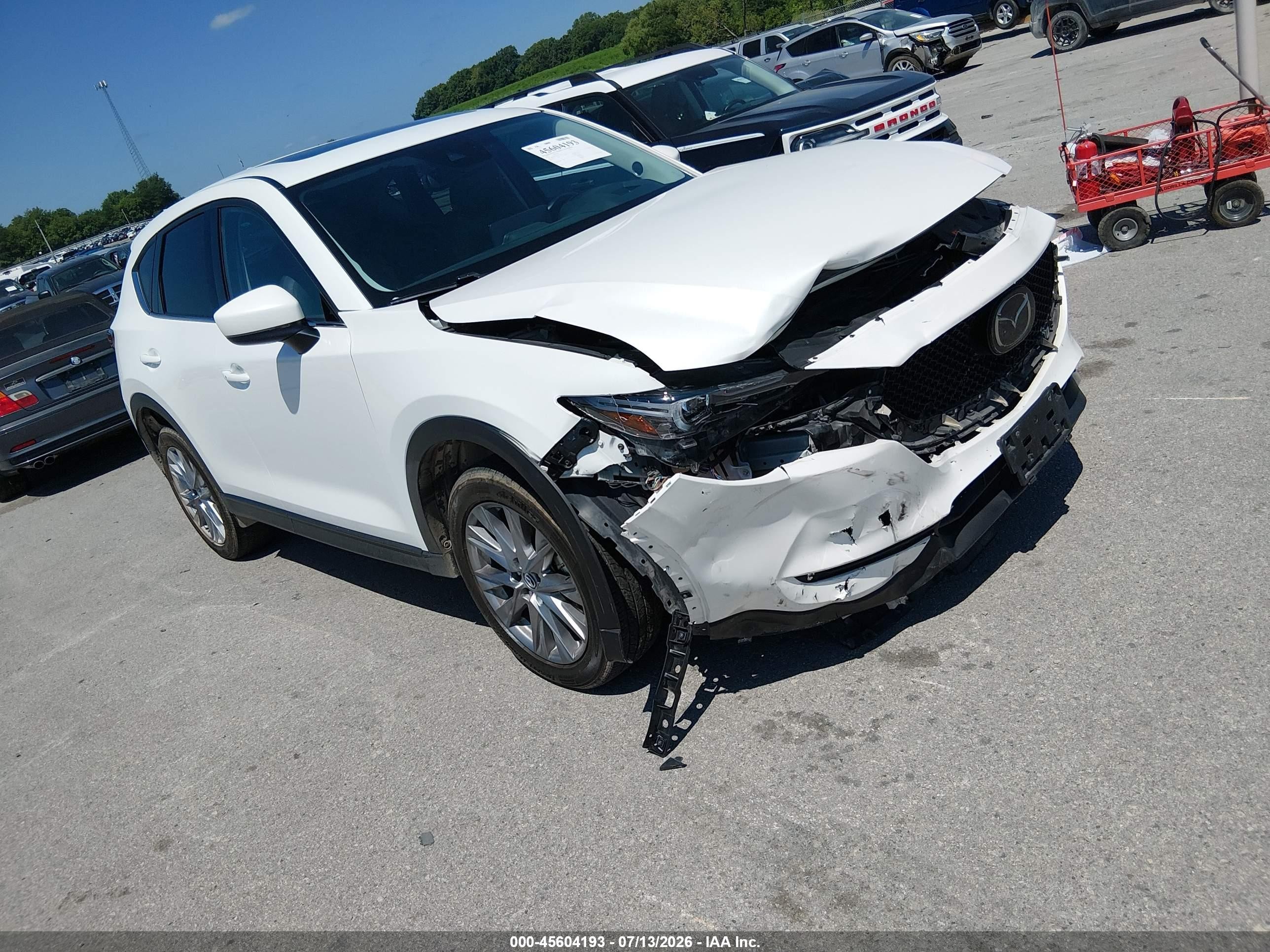 2021 Mazda CX-5 VIN JM3KFBDM4M1426121 — IAAI salvage auction photo