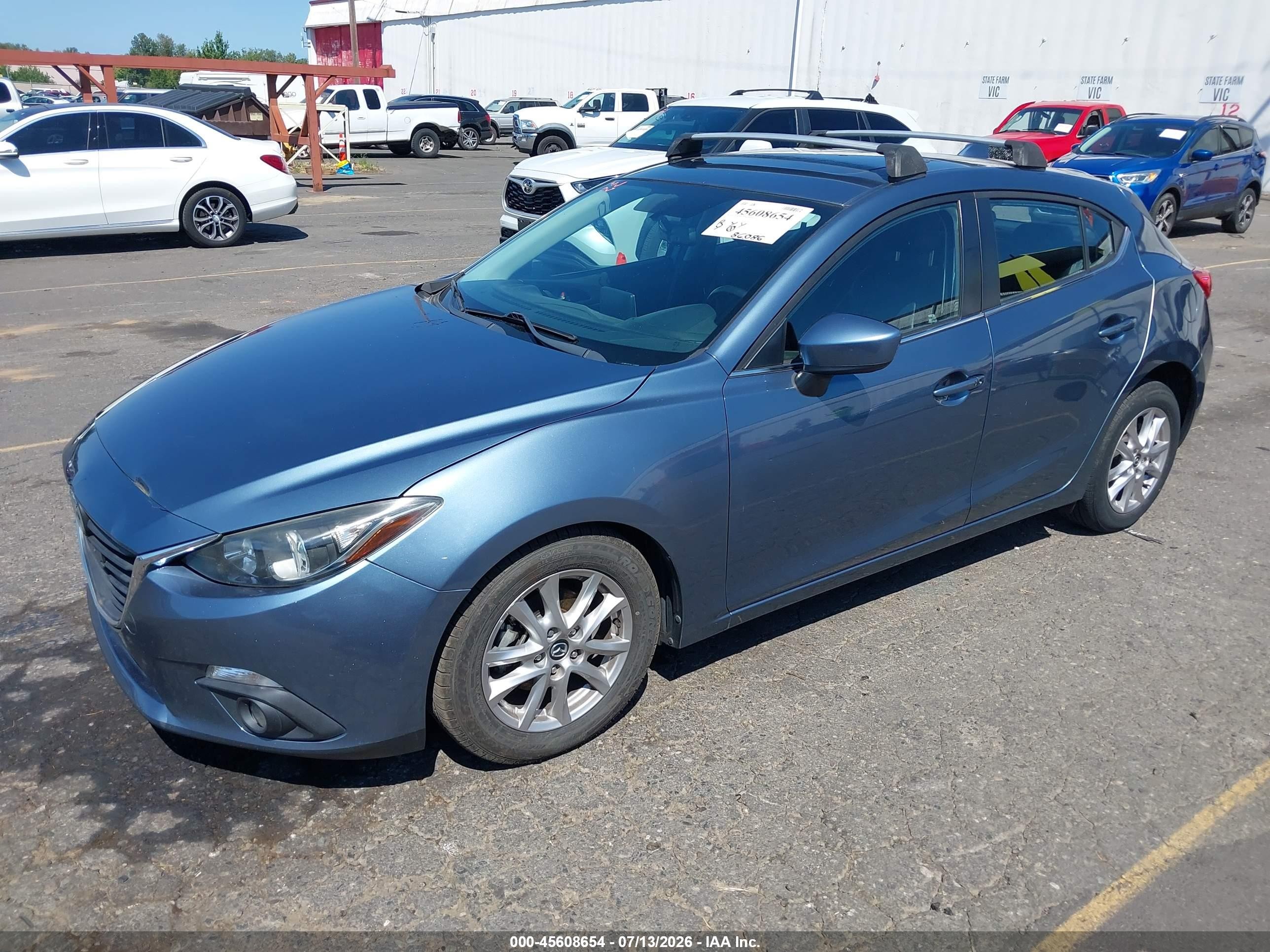 2015 Mazda 3 VIN JM1BM1M76F1240683 IAAI salvage auction — Side, Salvage (Oregon), sold $1,950 on 2026-09-18 (photo 2)