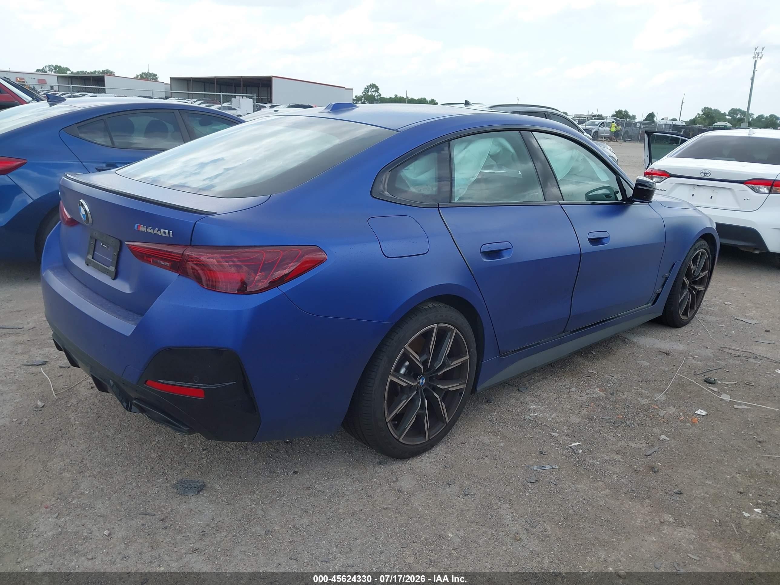 2026 BMW M440i Gran Coupe VIN WBA63FB08TFV88407 IAAI salvage auction — Side, Salvage (Texas), sold $32,750 on 2026-08-20 (photo 4)