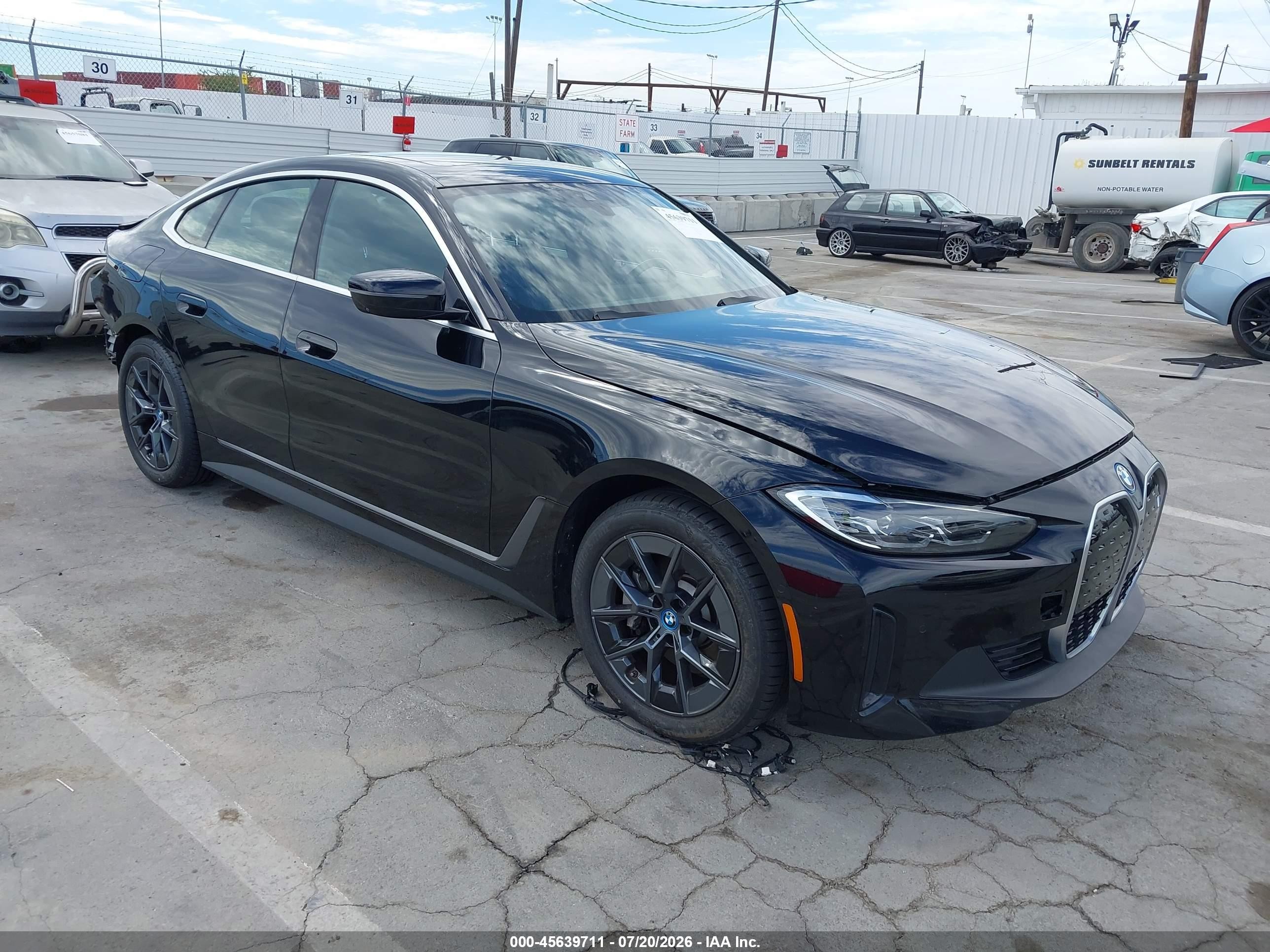 2024 BMW i4 VIN WBY43AW0XRFT29030 — IAAI salvage auction photo
