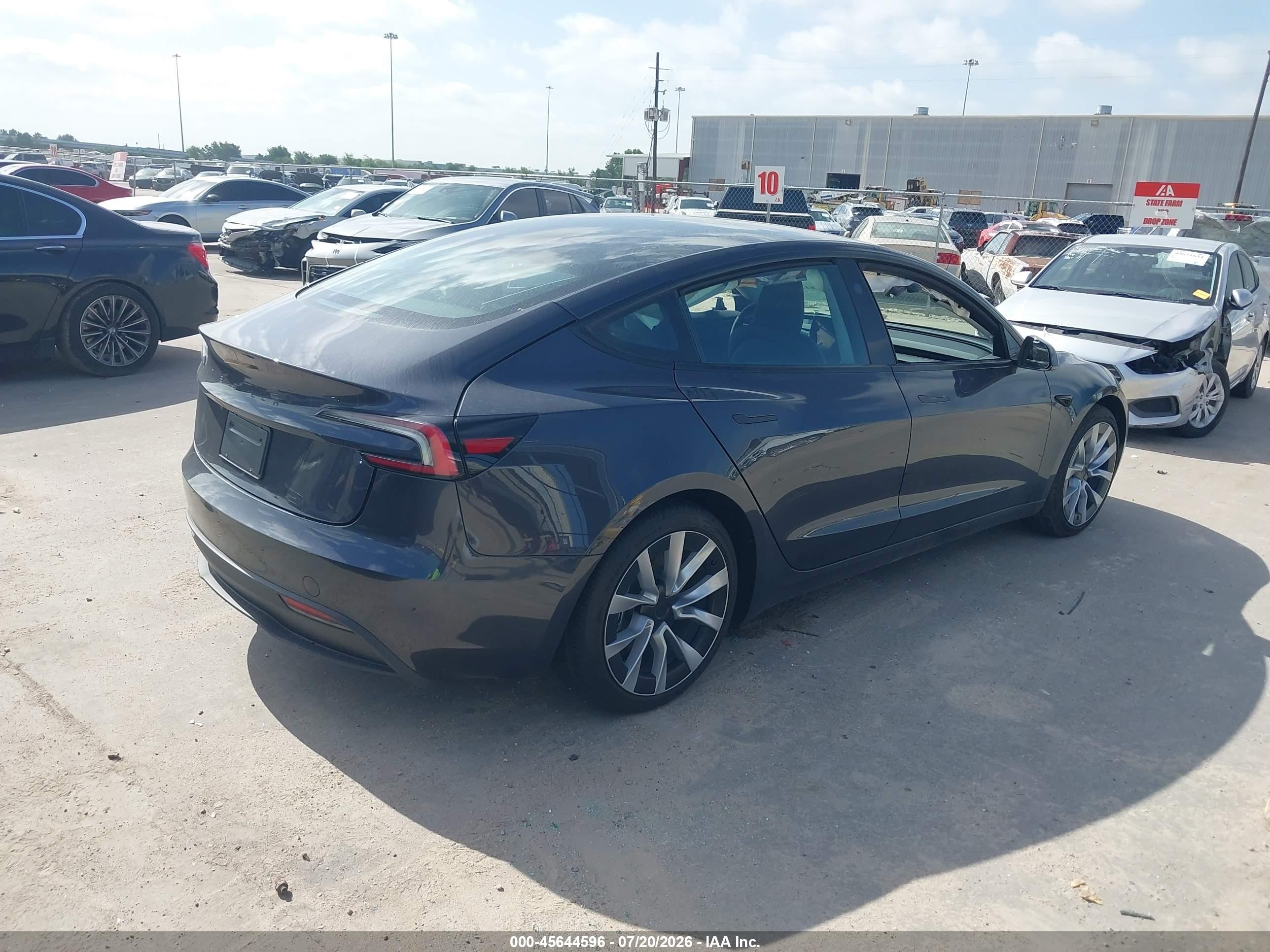 2026 Tesla Model 3 VIN 5YJ3E1EA6TF183576 IAAI salvage auction — Side, Wait Title, sold $10,900 on 2026-09-20 (photo 4)