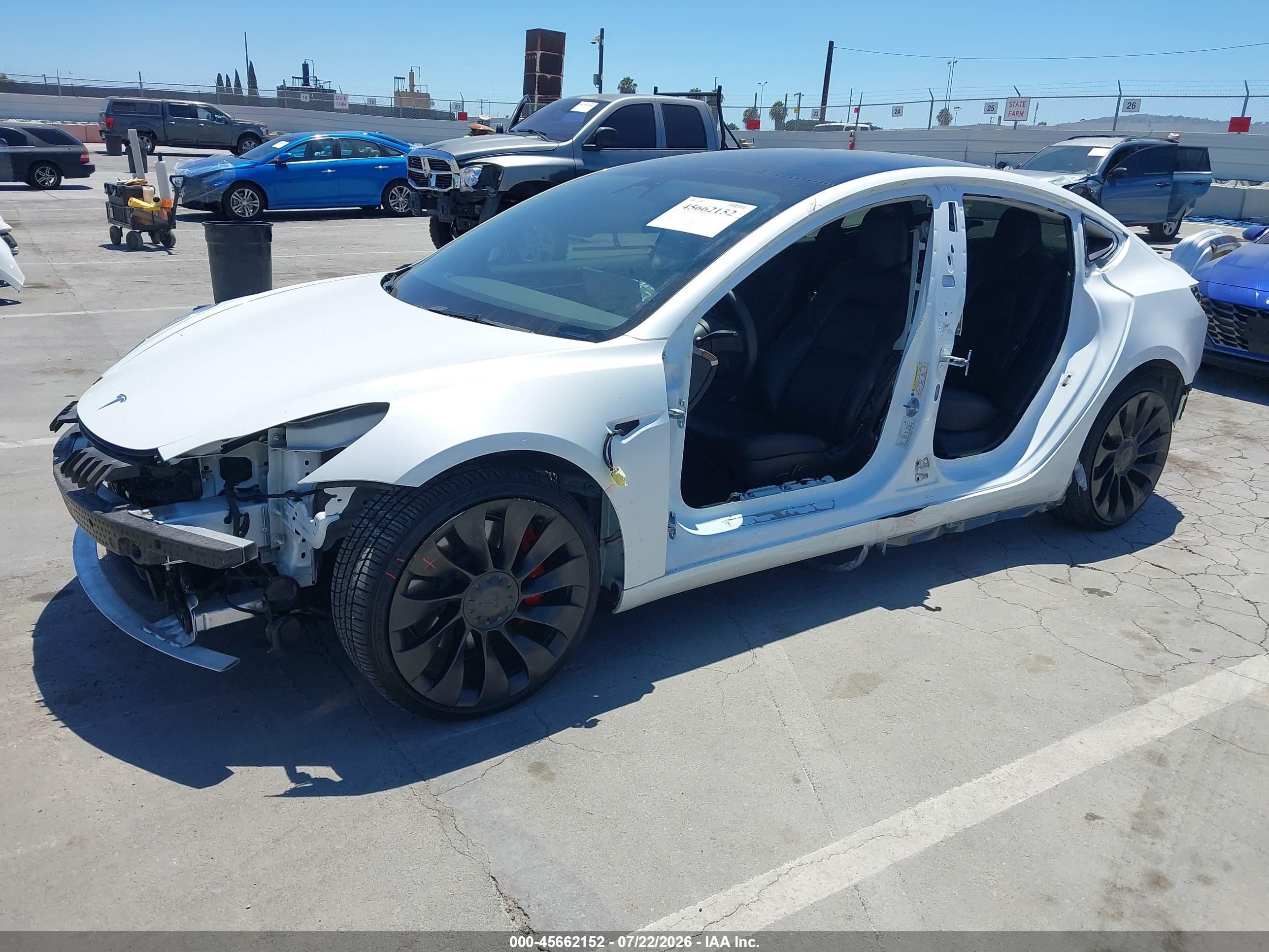 2022 Tesla Model 3 VIN 5YJ3E1EC9NF254757 IAAI salvage auction — Side, Salvage (California), sold $7,400 on 2026-09-13 (photo 2)