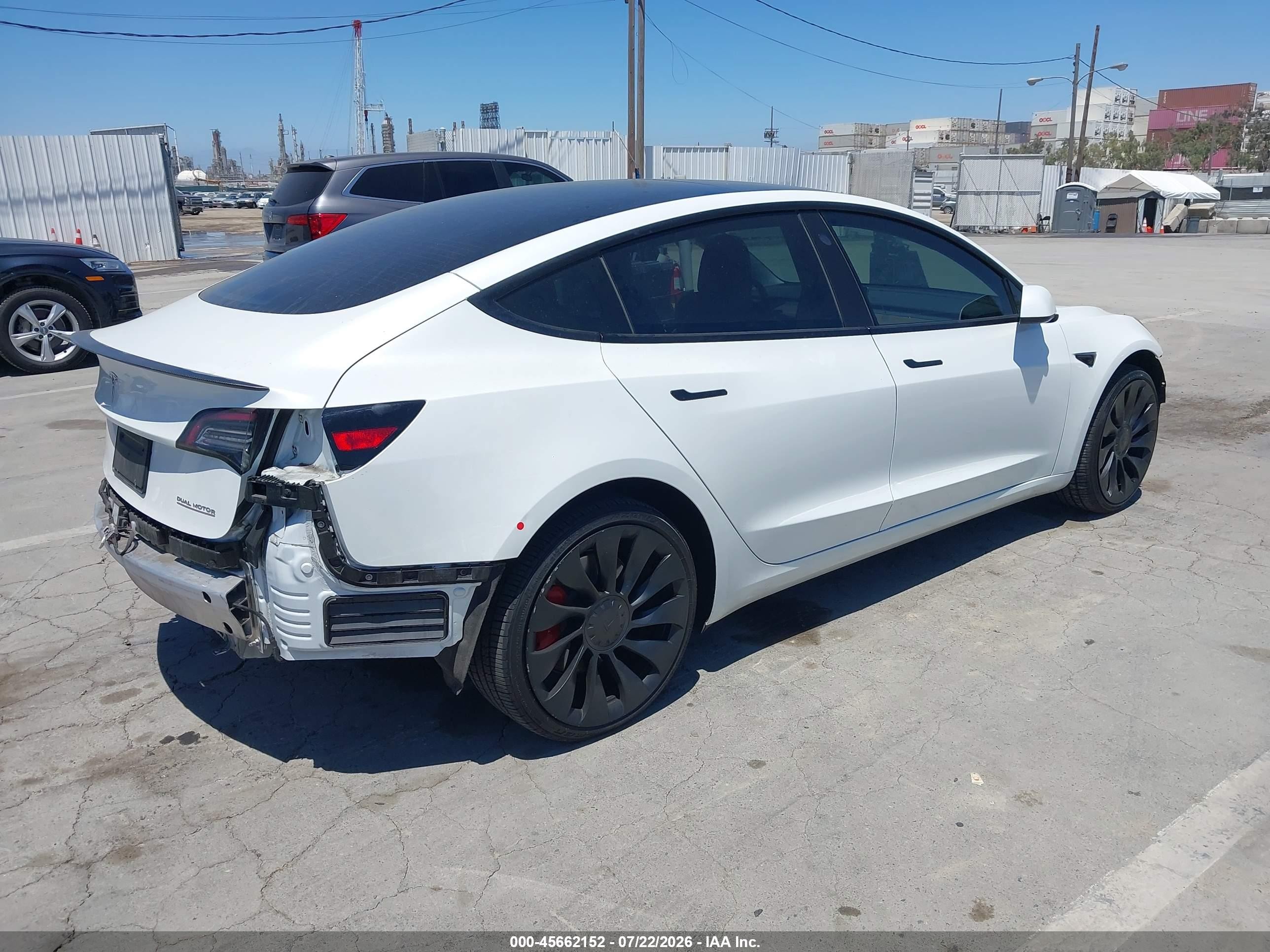 2022 Tesla Model 3 VIN 5YJ3E1EC9NF254757 IAAI salvage auction — Side, Salvage (California), sold $7,400 on 2026-09-13 (photo 4)