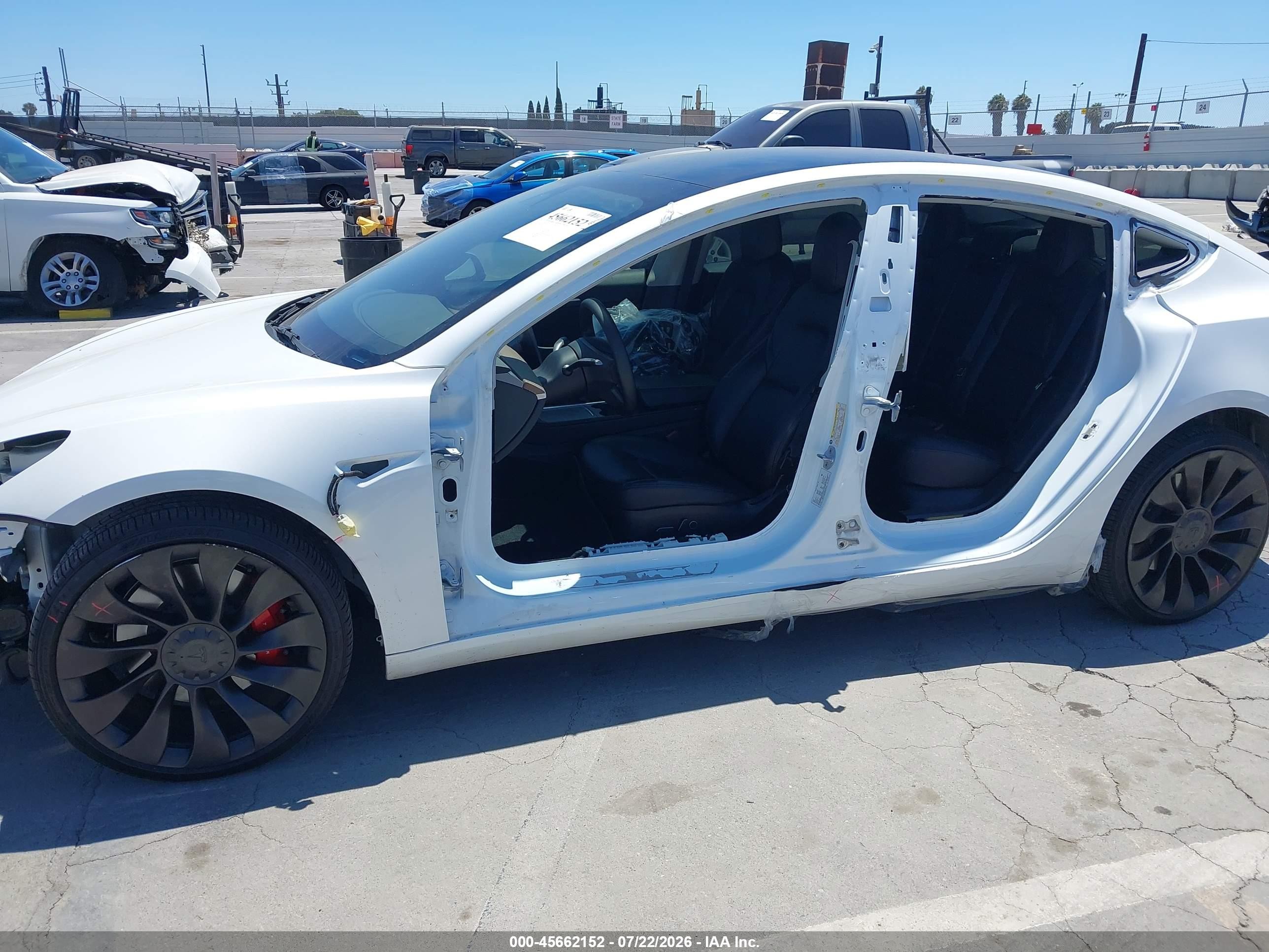2022 Tesla Model 3 VIN 5YJ3E1EC9NF254757 IAAI salvage auction — Side, Salvage (California), sold $7,400 on 2026-09-13 (photo 6)
