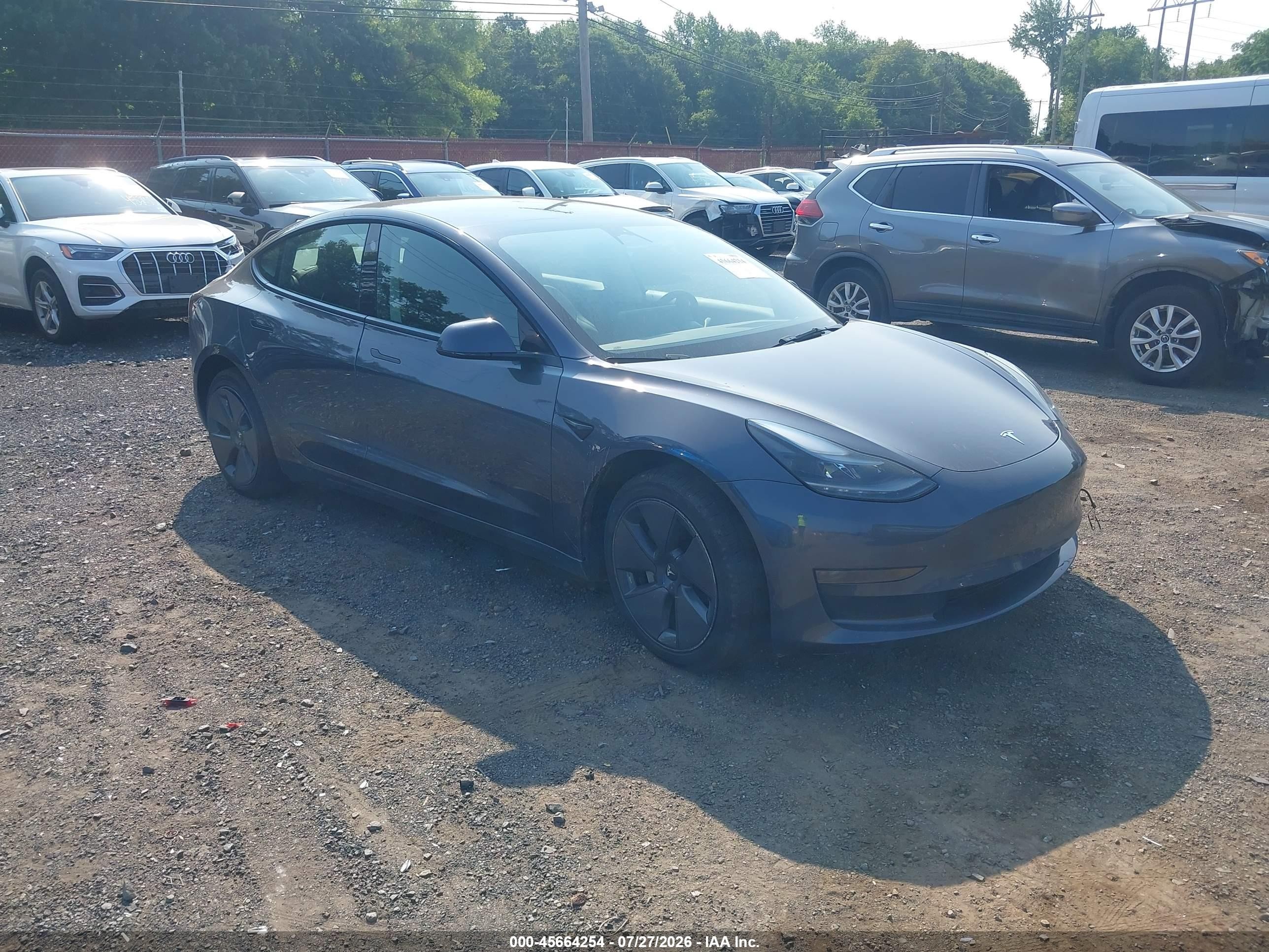 2023 Tesla Model 3 VIN 5YJ3E1EA2PF701799 IAAI salvage auction — Side, Salvage (Idaho), sold $8,600 on 2026-09-05 (photo 1)