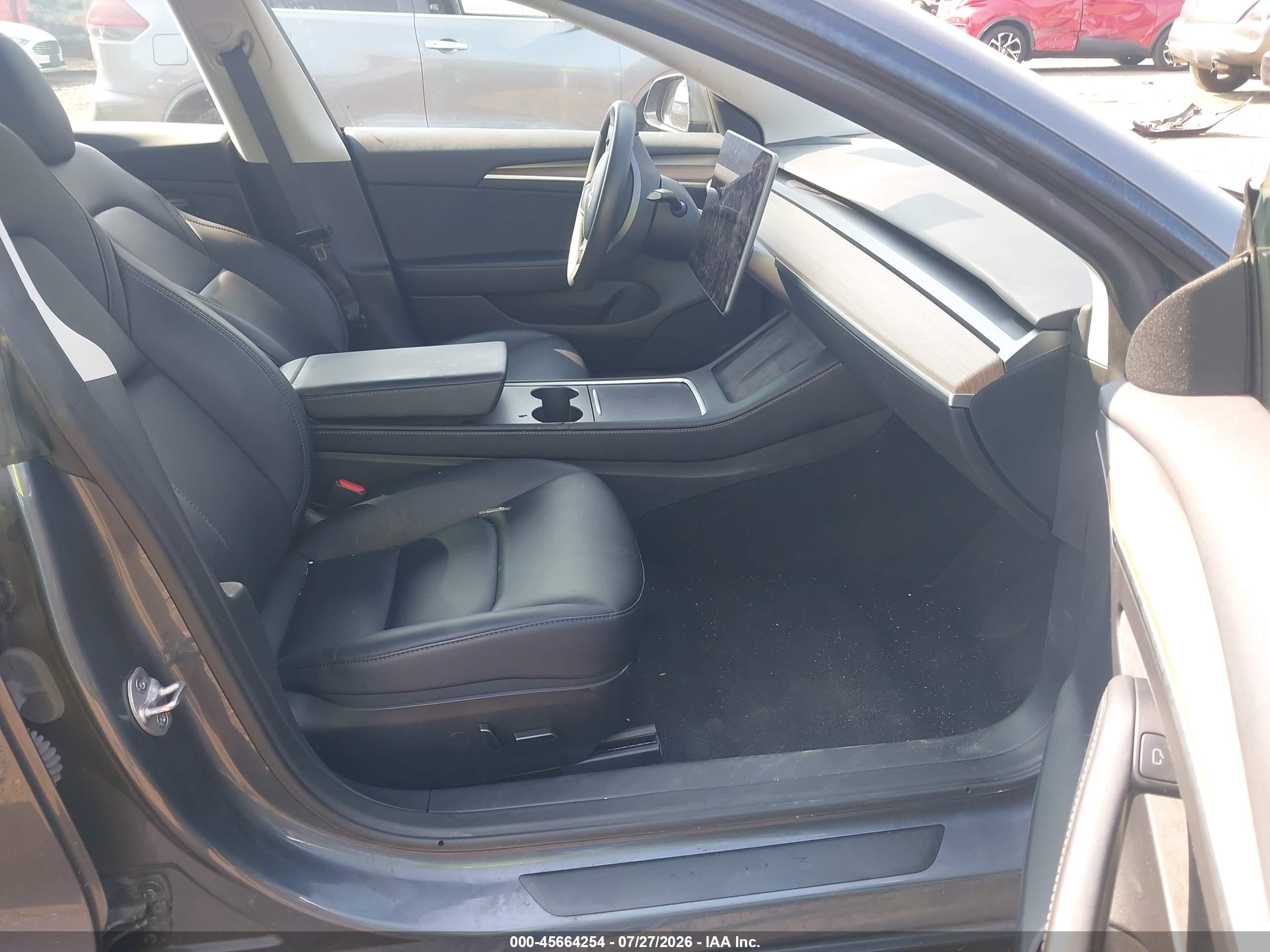 2023 Tesla Model 3 VIN 5YJ3E1EA2PF701799 IAAI salvage auction — Side, Salvage (Idaho), sold $8,600 on 2026-09-05 (photo 5)