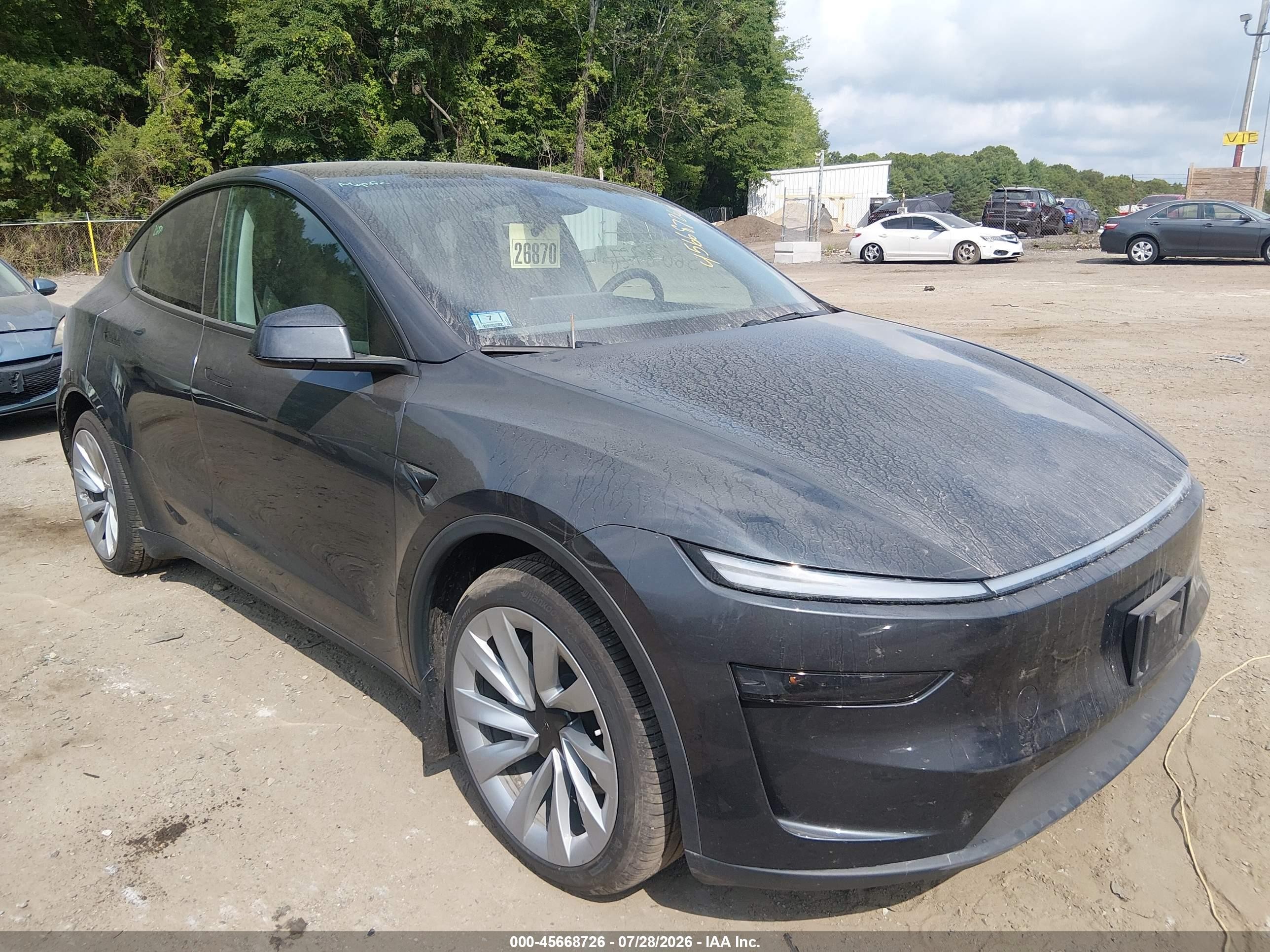 2026 Tesla Model y VIN 7SAYGDEEXTF388938 IAAI salvage auction — Side, Salvage (Idaho), sold $25,250 on 2026-10-08 (photo 1)