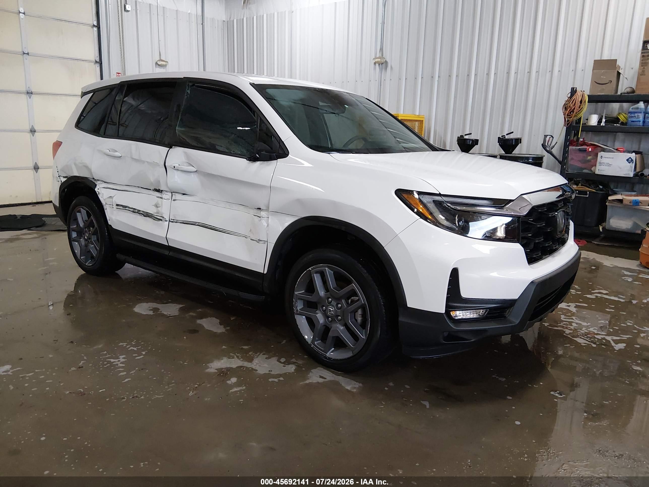 2023 Honda Passport VIN 5FNYF8H56PB019714 — IAAI salvage auction photo