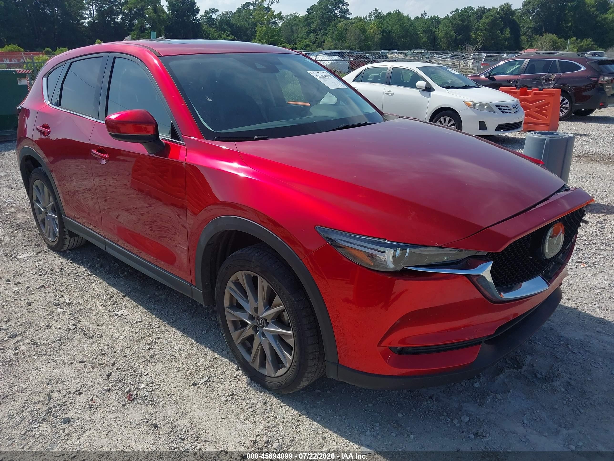 2021 Mazda CX-5 VIN JM3KFADM1M0476684 — IAAI salvage auction photo