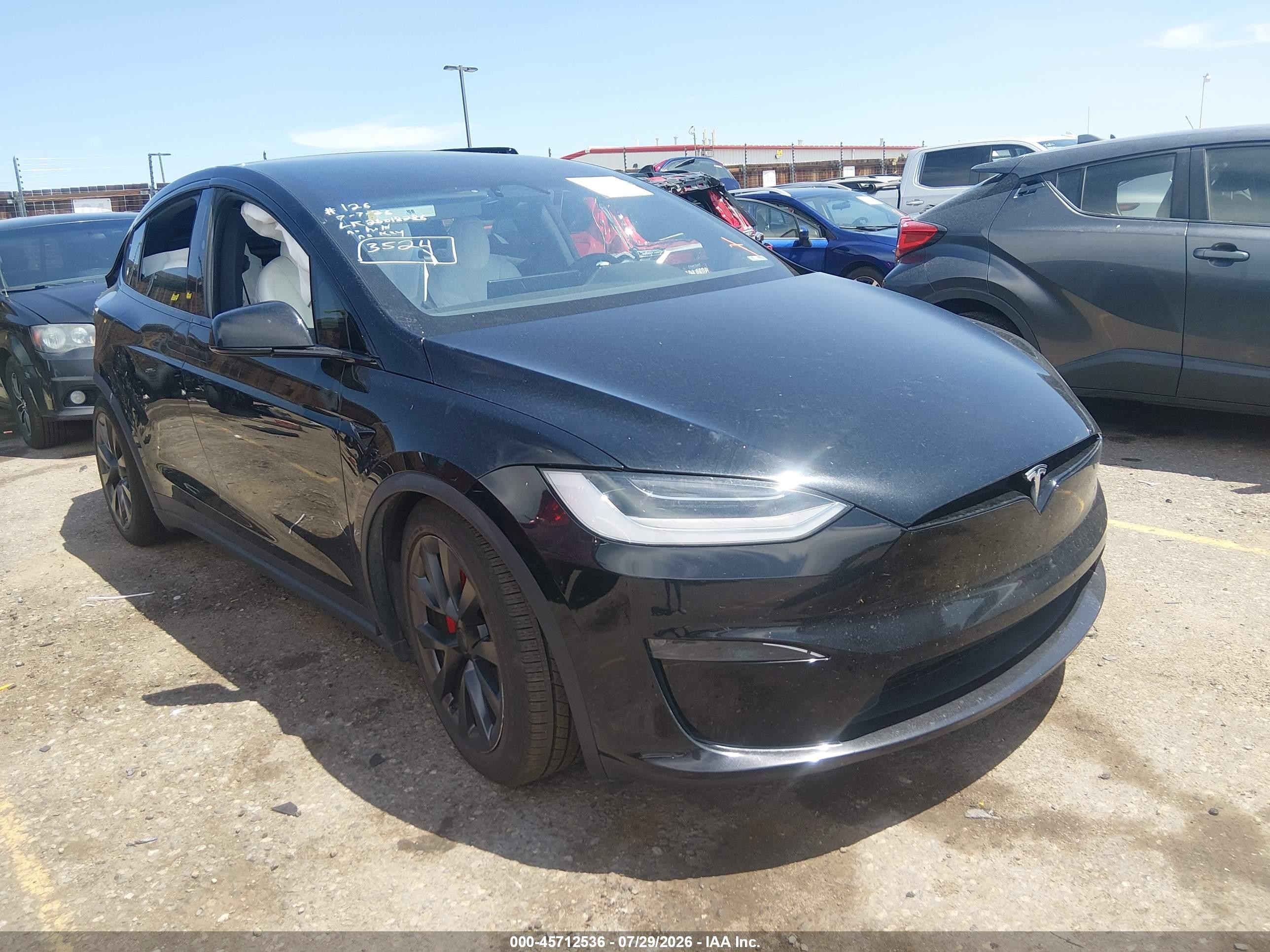 2023 Tesla Model X VIN 7SAXCBE69PF395440 — IAAI salvage auction photo
