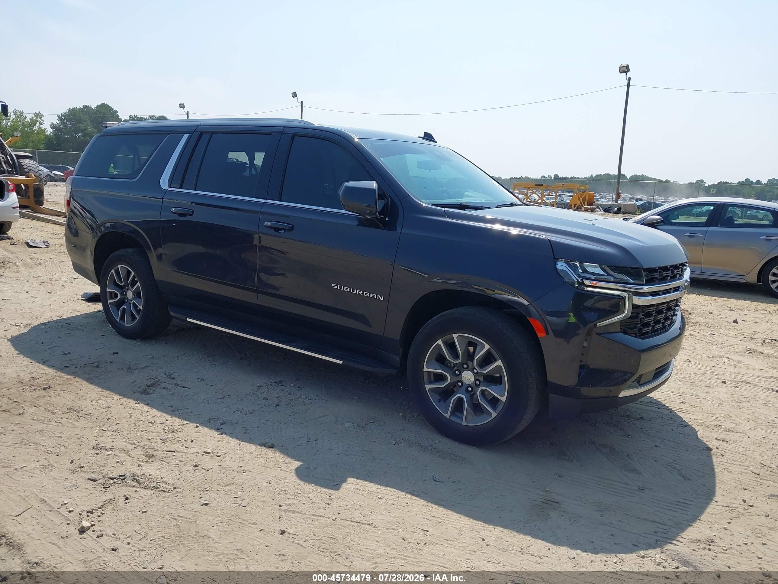 2023 Chevrolet Suburban VIN 1GNSCBKDXPR115844 — IAAI salvage auction photo