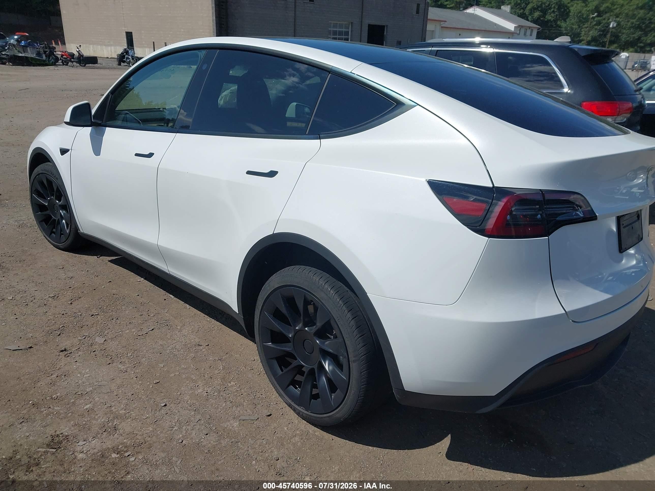 2023 Tesla Model Y VIN 7SAYGDEE2PA080620 IAAI salvage auction — Unknown, Salvage (Massachusetts), sold $10,500 on 2026-10-04 (photo 3)