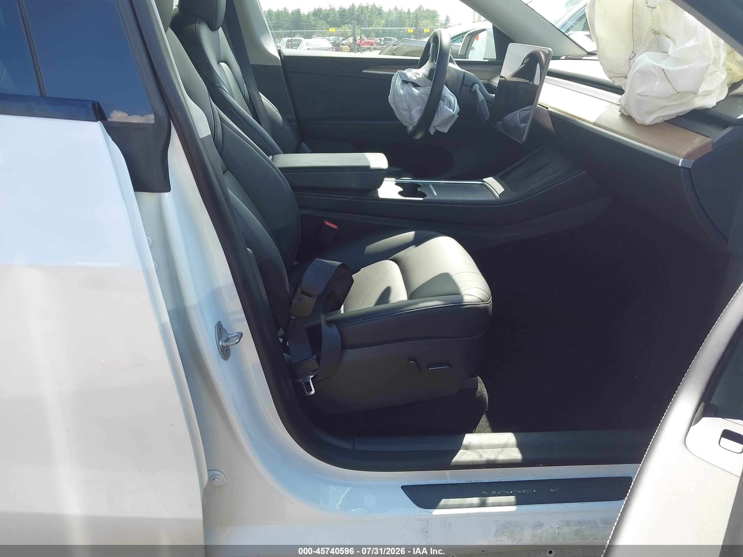 2023 Tesla Model Y VIN 7SAYGDEE2PA080620 IAAI salvage auction — Unknown, Salvage (Massachusetts), sold $10,500 on 2026-10-04 (photo 5)