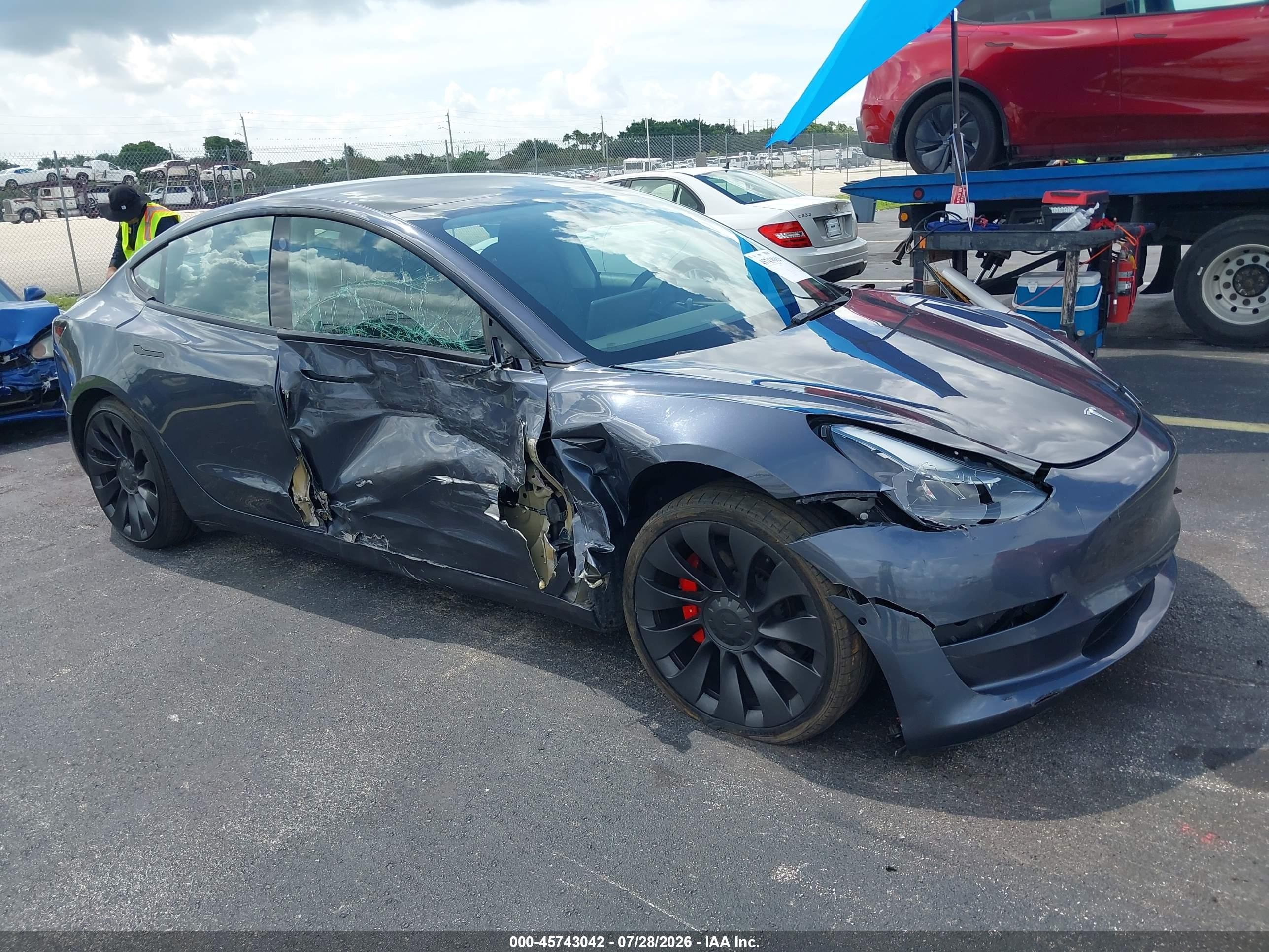 2022 Tesla Model 3 VIN 5YJ3E1EC2NF104182 — IAAI salvage auction photo