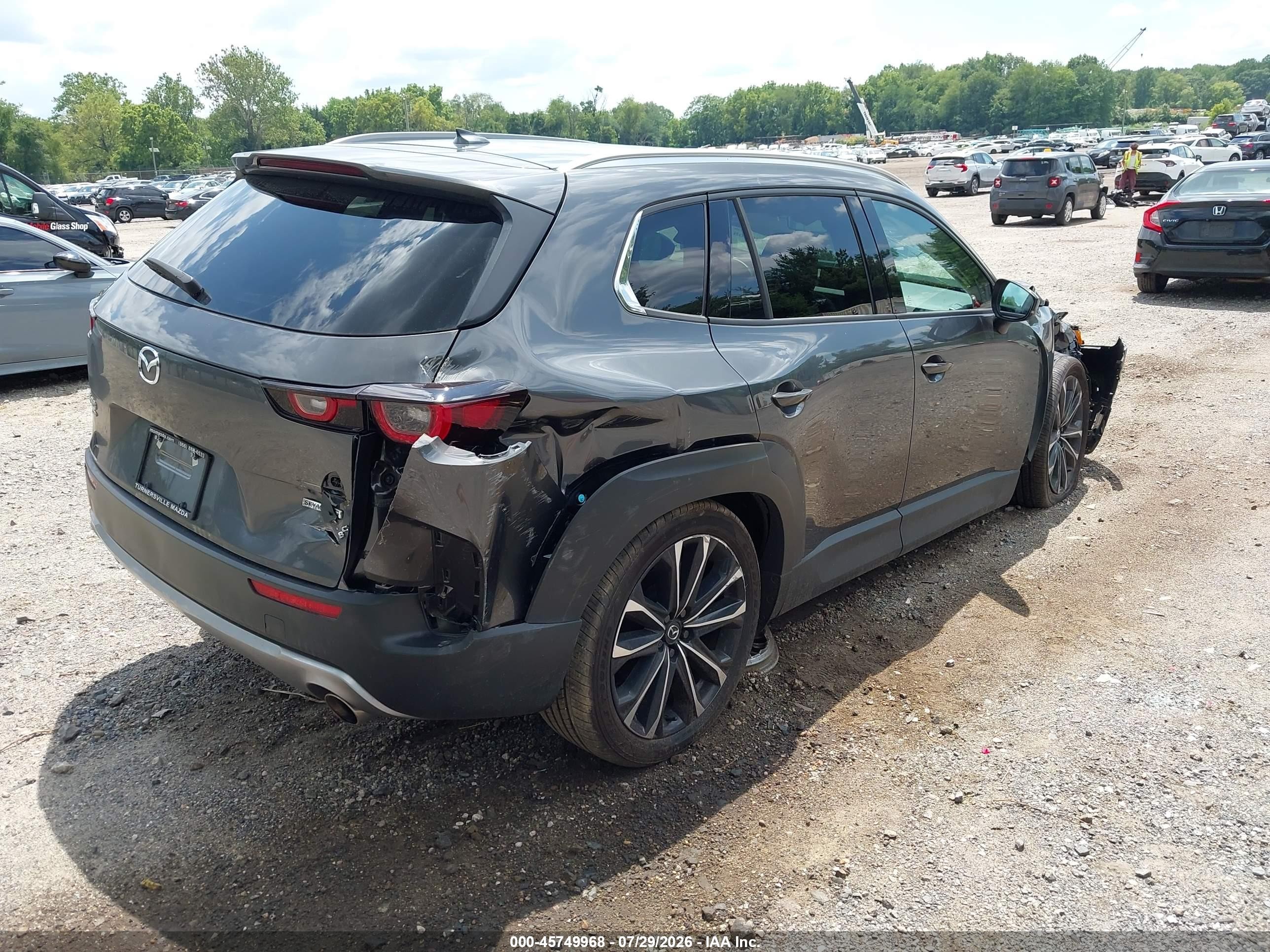 2025 Mazda CX-50 VIN 7MMVABDY8SN386560 IAAI salvage auction — Side, Salvage (Idaho), sold $6,925 on 2026-09-24 (photo 4)