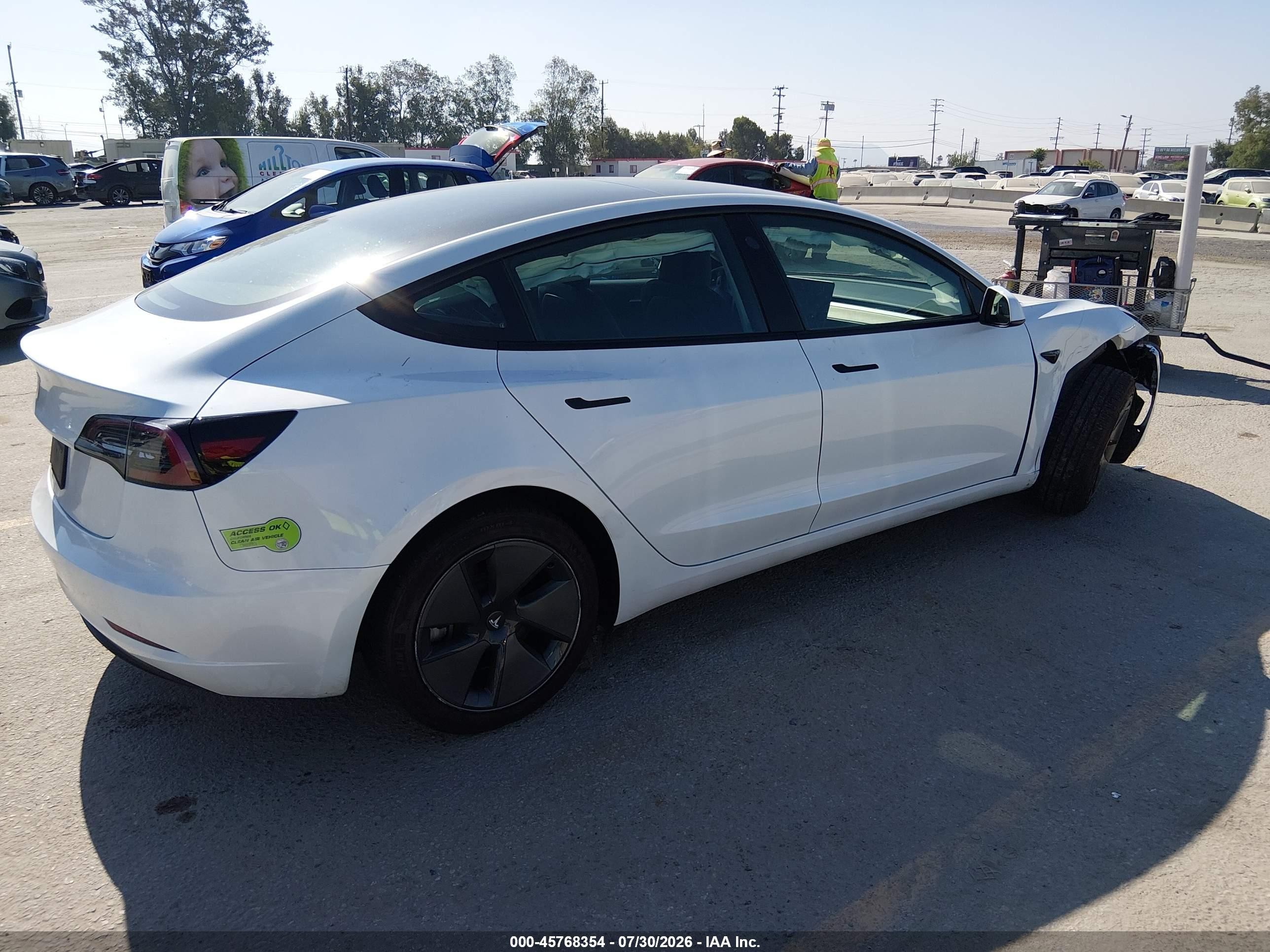2023 Tesla Model 3 VIN 5YJ3E1EA0PF568203 IAAI salvage auction — Unknown, Salvage (California), sold $7,400 on 2026-09-07 (photo 4)