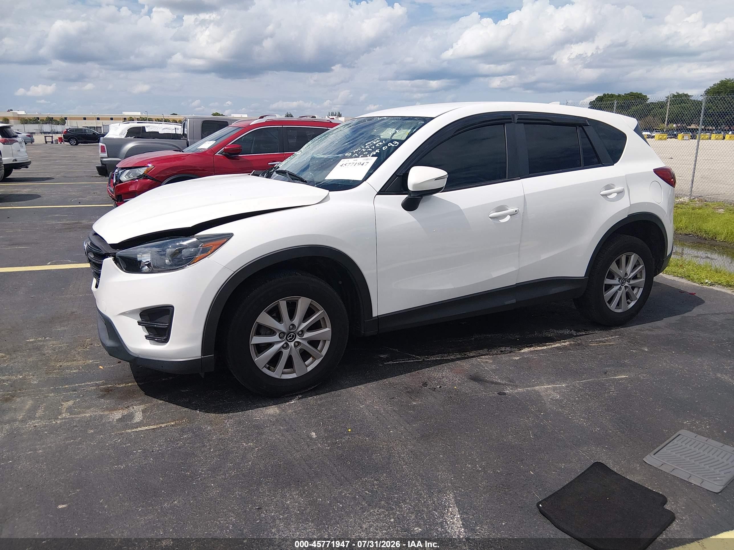 2016 Mazda CX-5 VIN JM3KE2BY9G0689093 IAAI salvage auction — Side, Rebuildable (Florida), sold $1,400 on 2026-09-14 (photo 2)