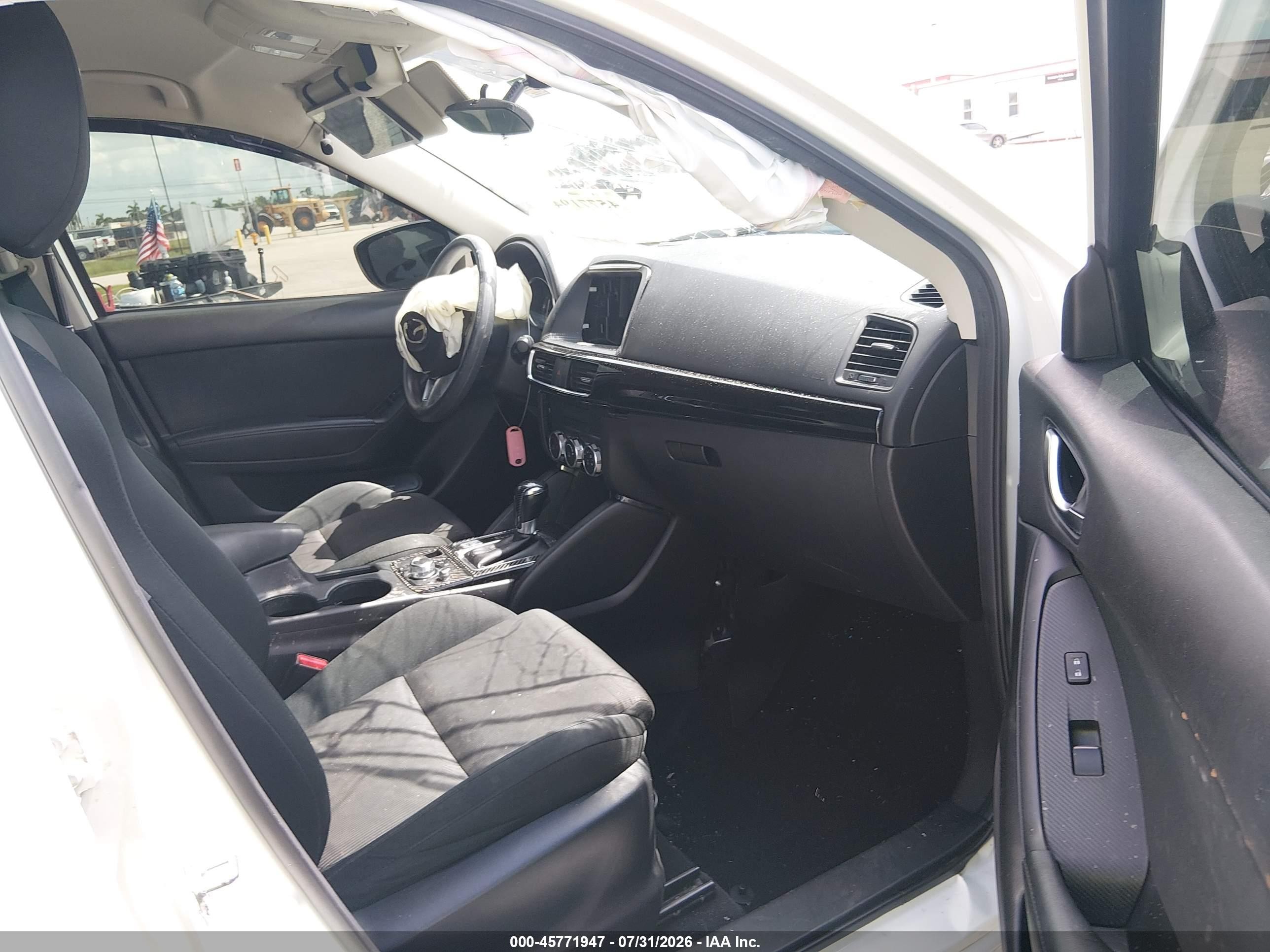 2016 Mazda CX-5 VIN JM3KE2BY9G0689093 IAAI salvage auction — Side, Rebuildable (Florida), sold $1,400 on 2026-09-14 (photo 5)