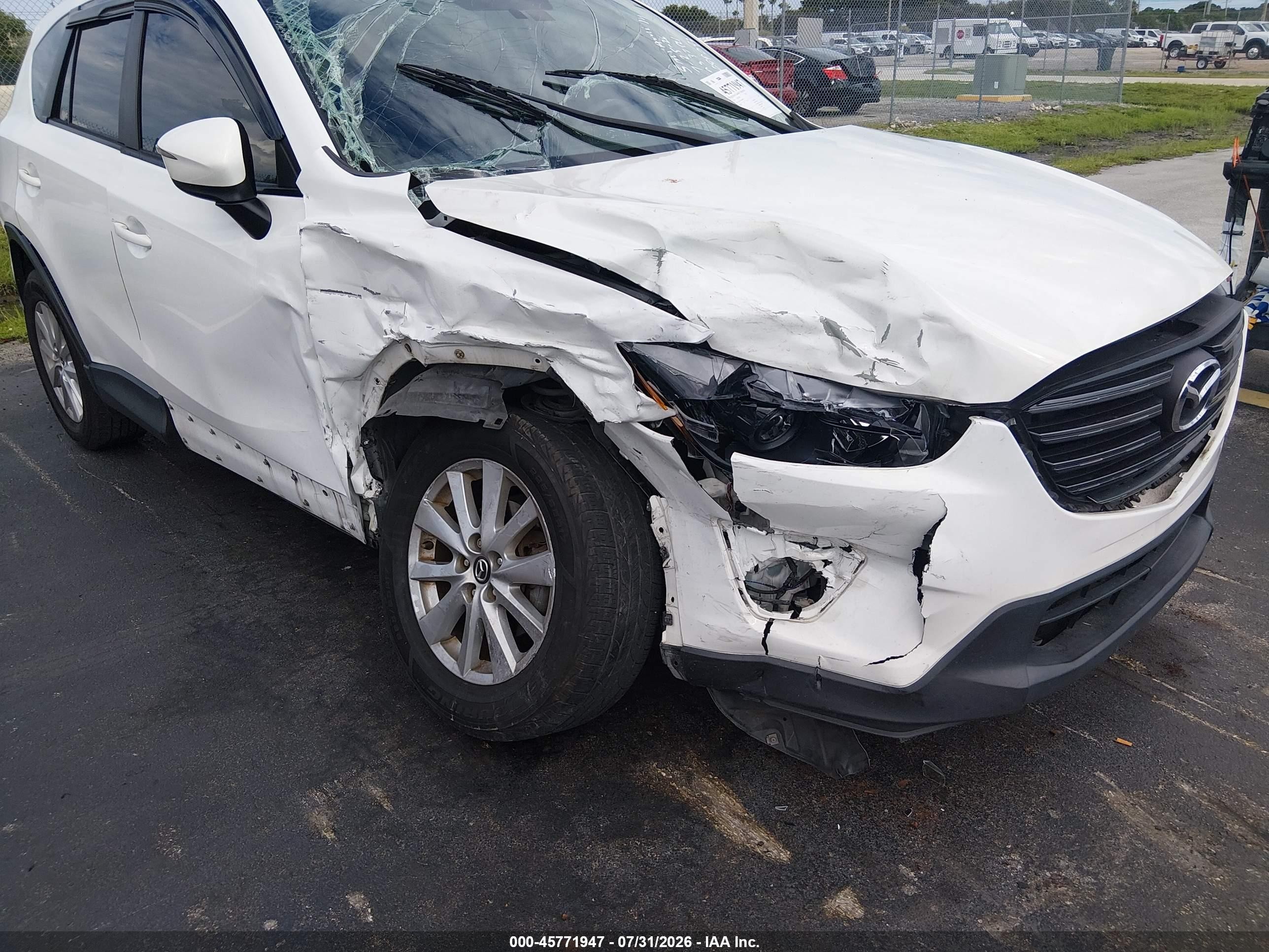 2016 Mazda CX-5 VIN JM3KE2BY9G0689093 IAAI salvage auction — Side, Rebuildable (Florida), sold $1,400 on 2026-09-14 (photo 6)