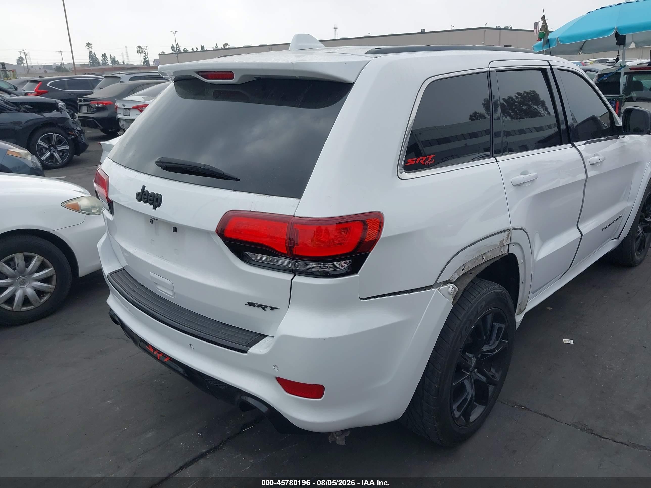 2015 Jeep Grand Cherokee VIN 1C4RJFDJ5FC917999 IAAI salvage auction — Vandalized, Salvage Certificate (California), sold $5,600 on 2026-09-13 (photo 4)