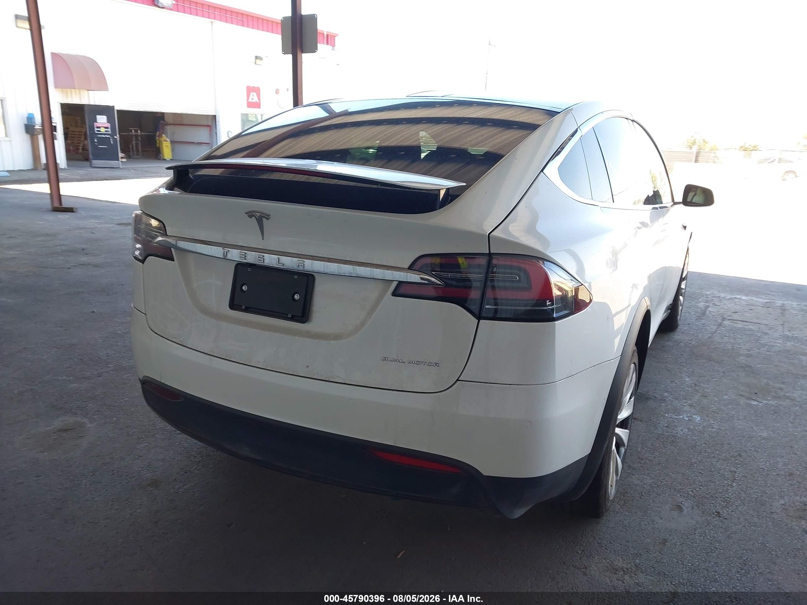 2020 Tesla Model x VIN 5YJXCBE24LF283004 IAAI salvage auction — Unknown, Salvage (California), sold $19,200 on 2026-10-12 (photo 4)